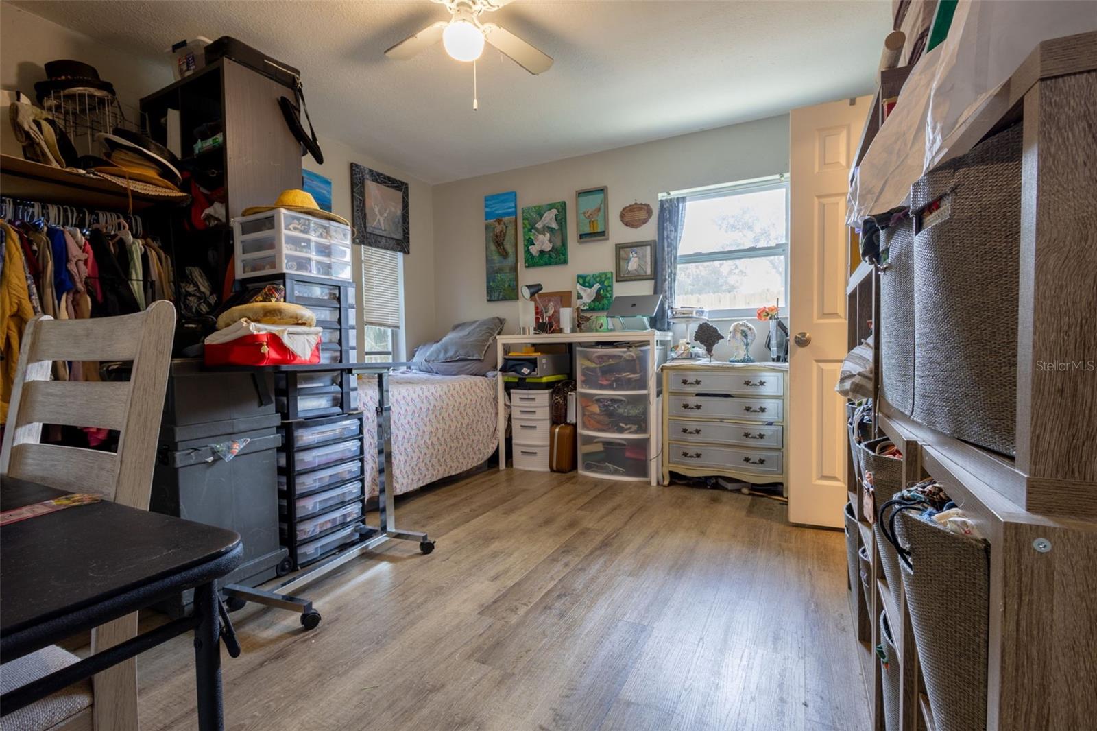 Primary bedroom, good size, just a lot of craft things