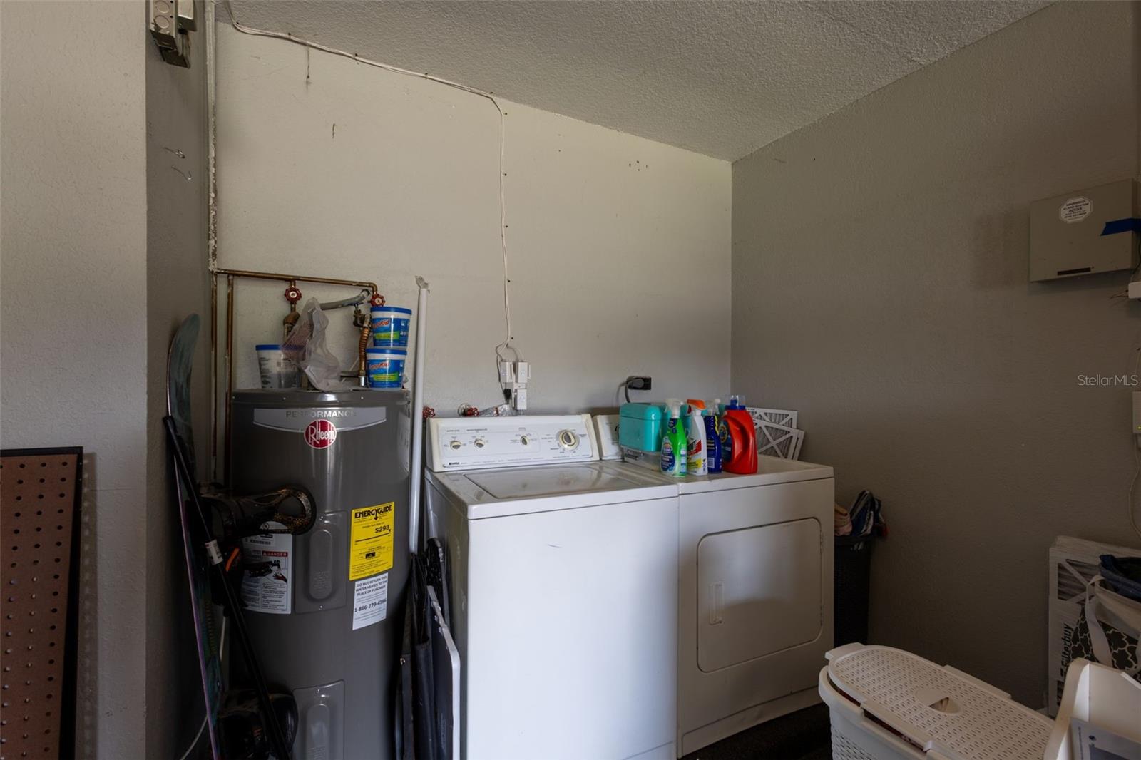 Laundry and newer water heater in garage
