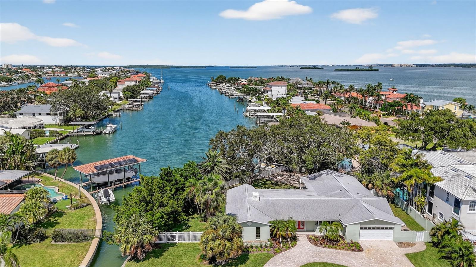 Welcome to Island Estates Living, where privacy and water views abound at 514 Windward Passge