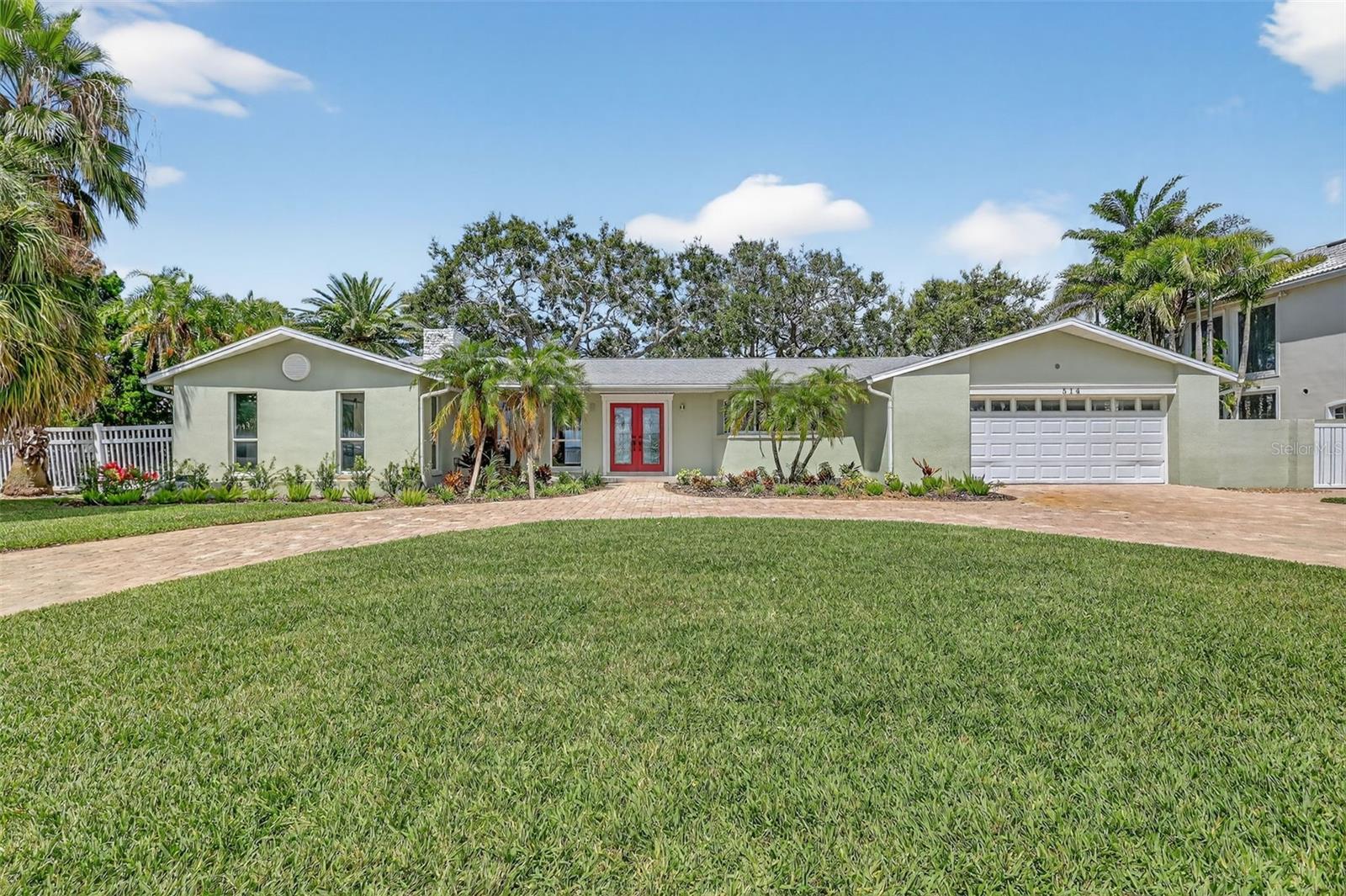 This home is welcoming and has a circular drive and a 2 car garage