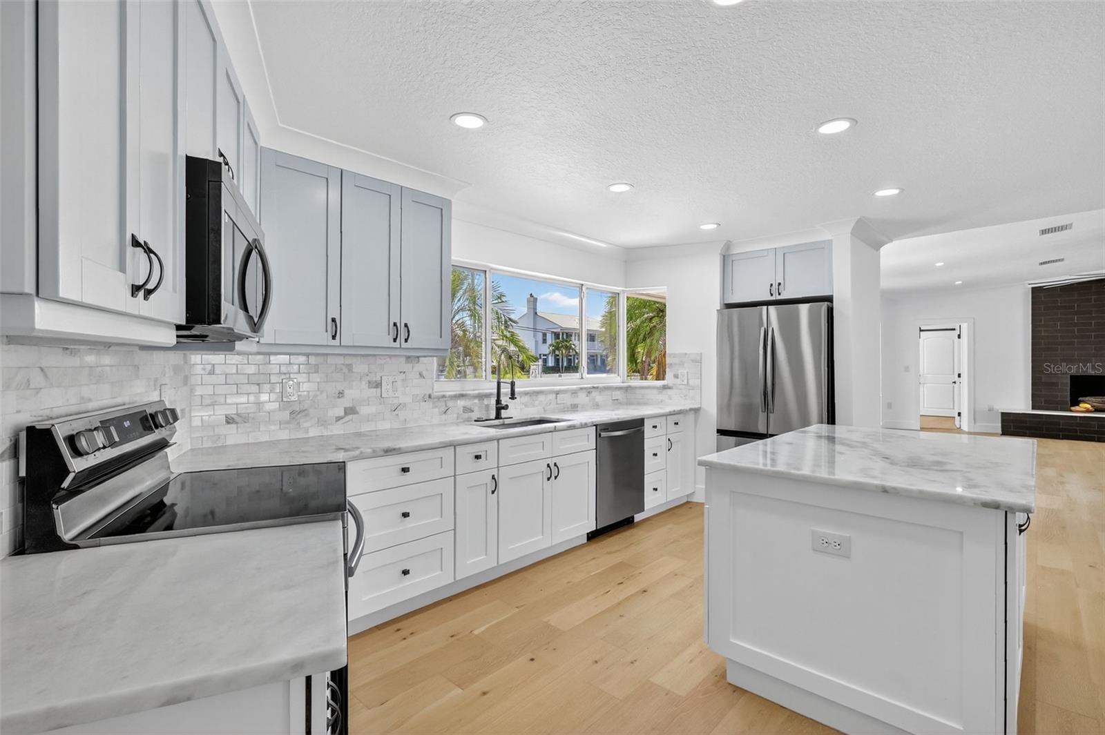 This kitchen has plenty of work space and makes it easy to work and entertain at the same time.