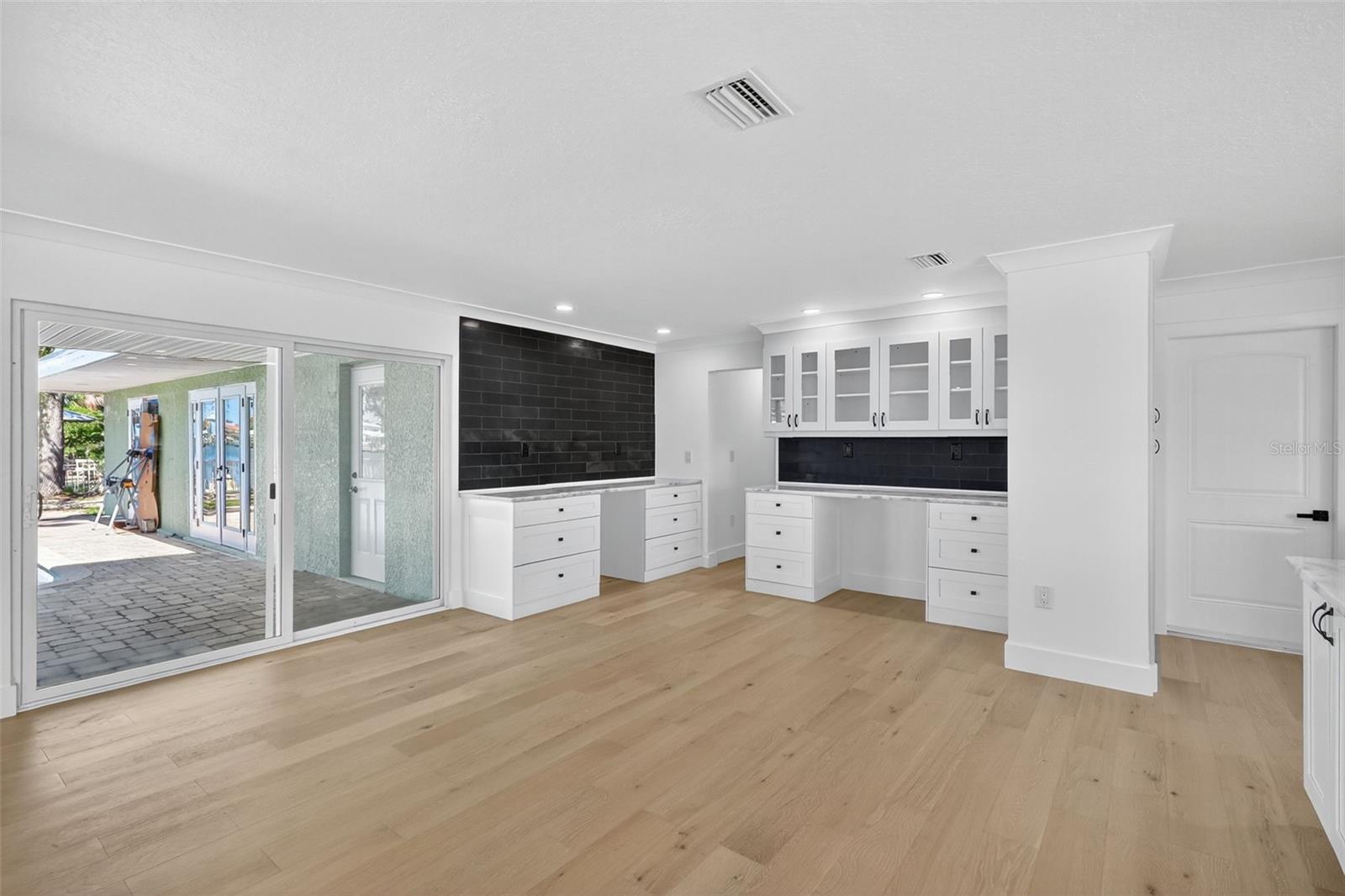 The dining area leads out to the pool for easy outdoor living