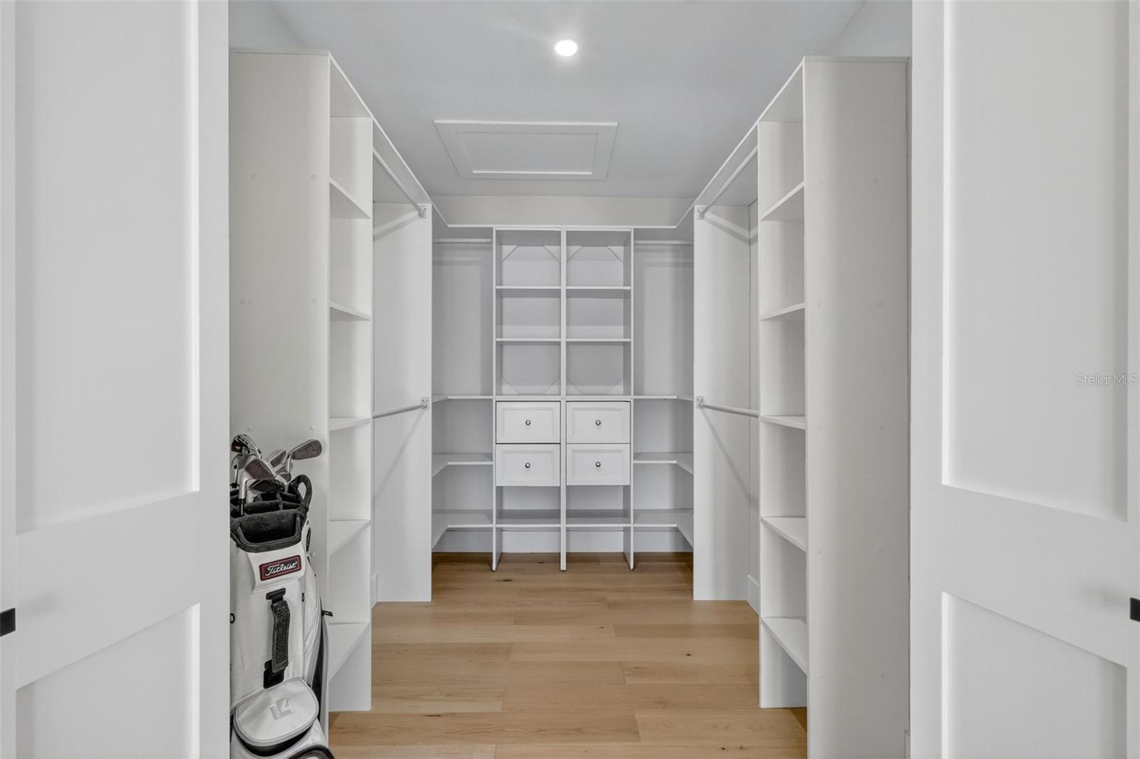 This closet is ready for anything with built in shelfing and more.