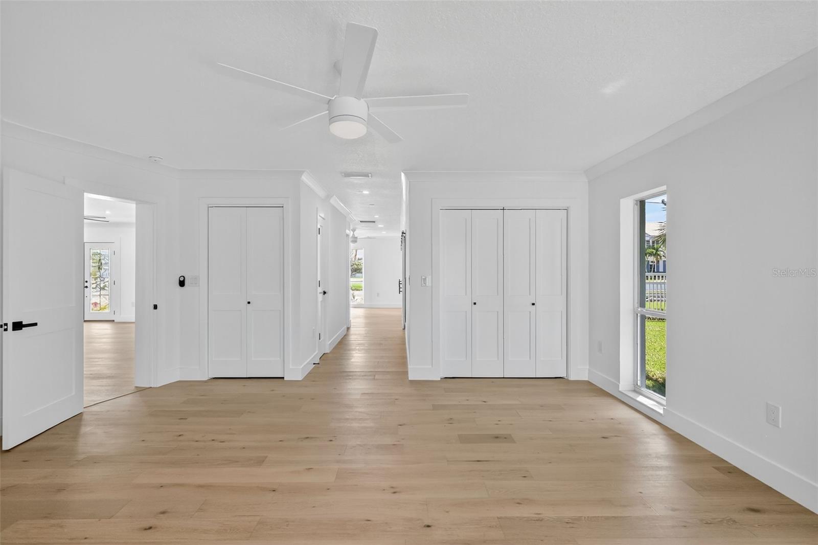 From the bedroom area of the Main Bedroom you have additional closet space and a hall way with Linen Closets leading to the En-Suite