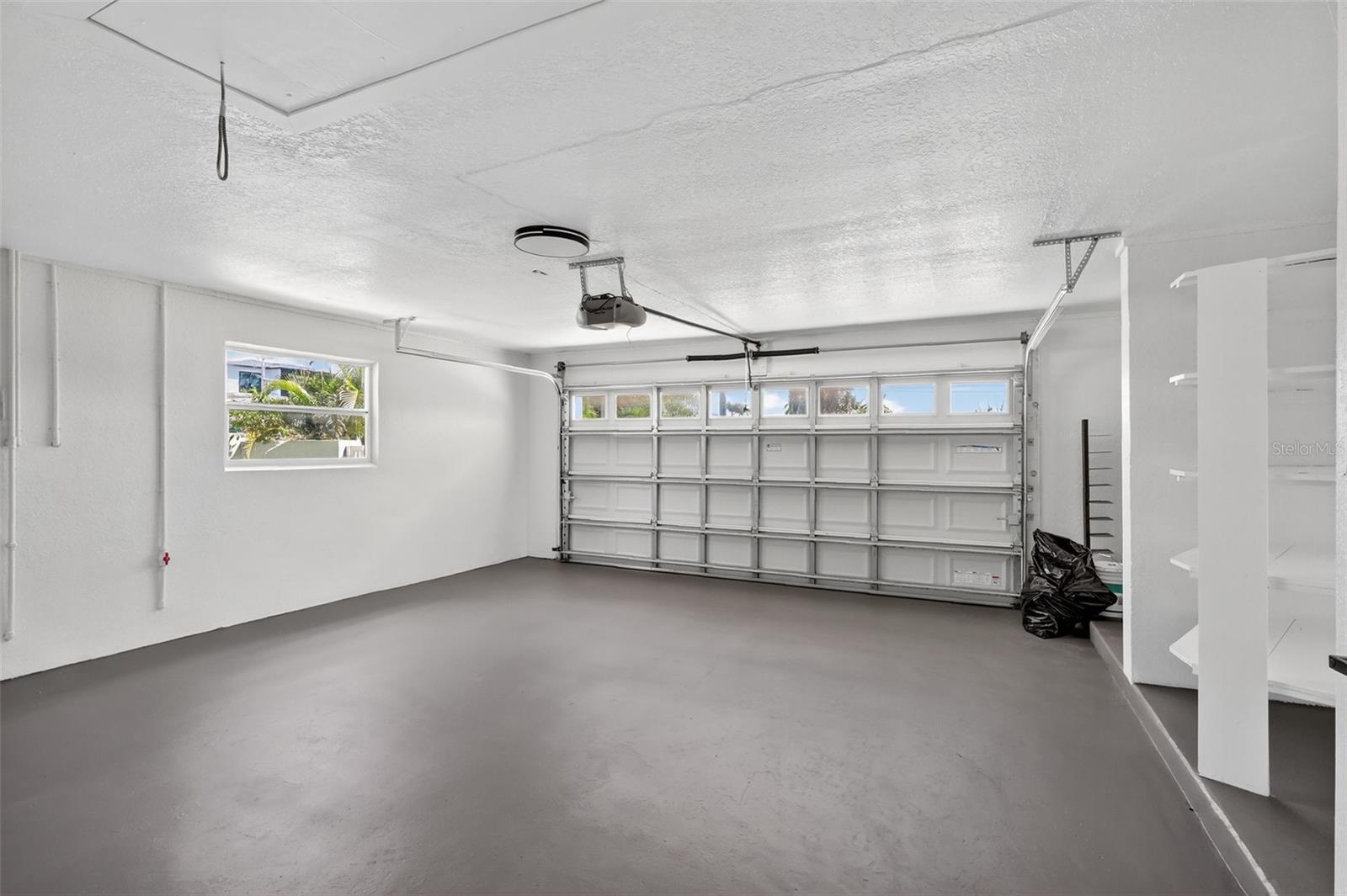 Large Garage with built in Storage and pull down to the attic area