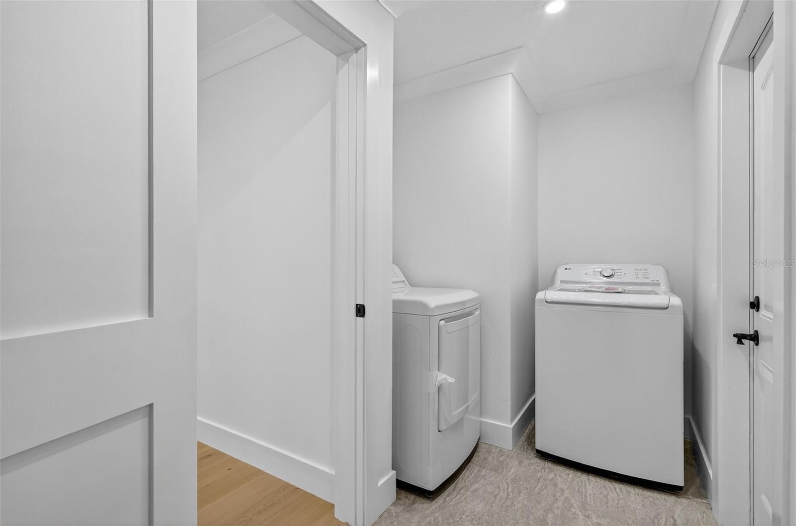 The Laundry area is off the garage and interior hallway and has built in storage