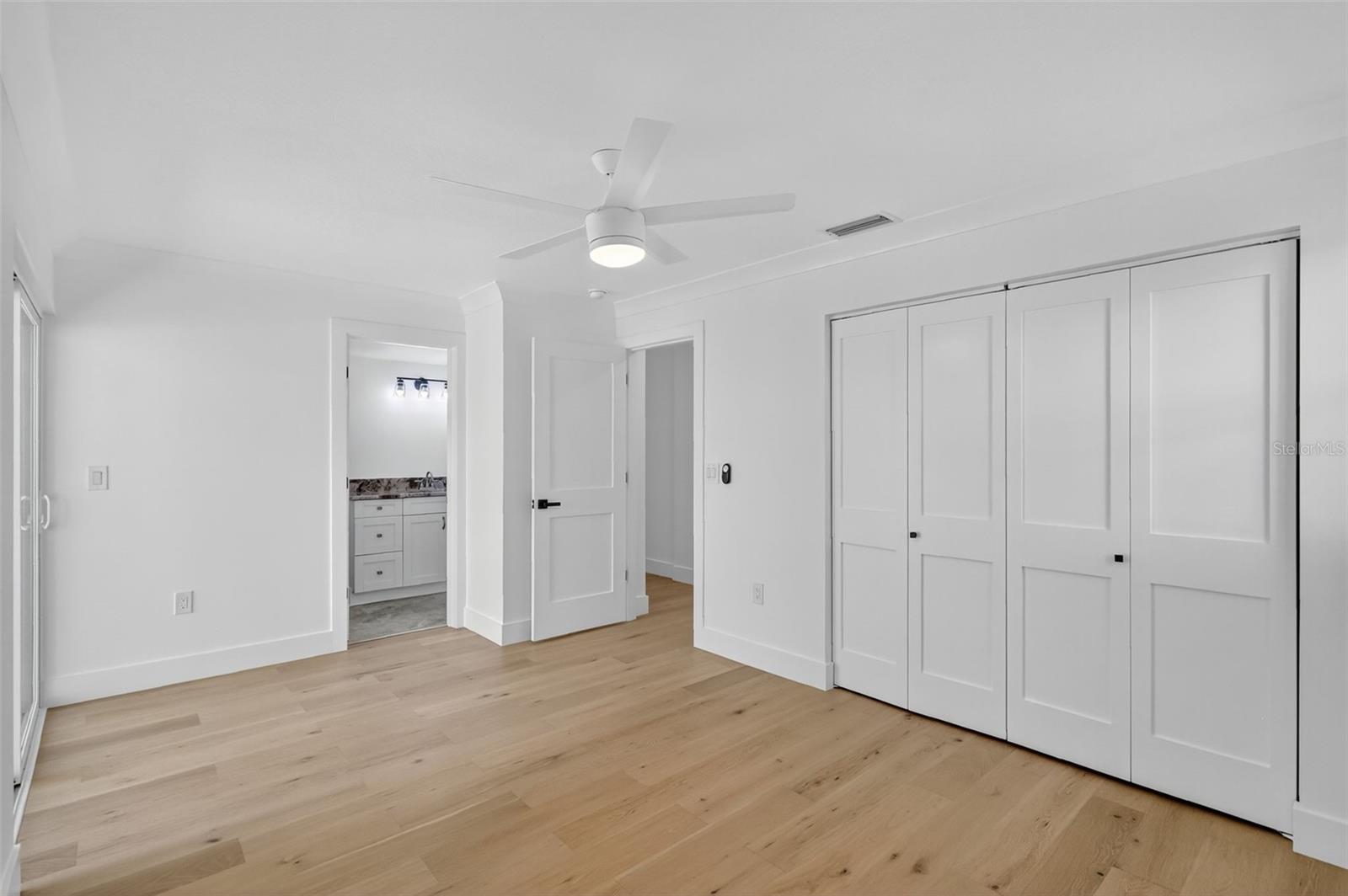 Bedroom 5, leads out to the pool area and has an En-Suite bath