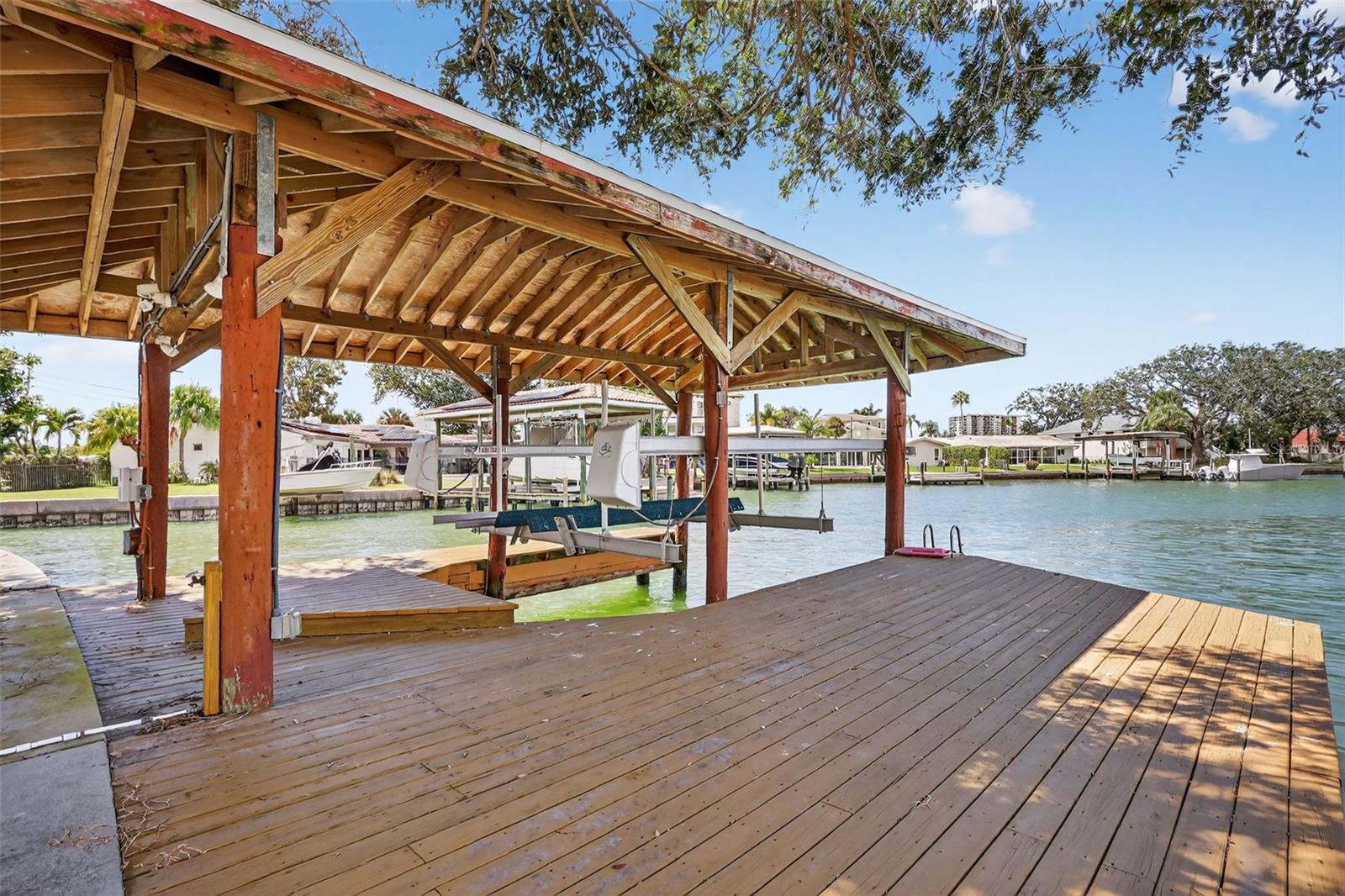 Bring your boat, covered boathouse and life at this property.