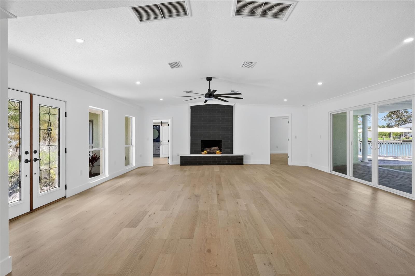 The living area has a grand wood burning fireplace for cool evening