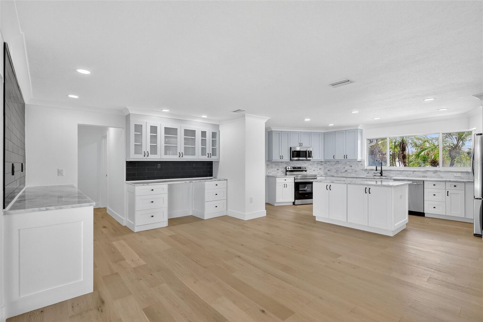 The kitchen and dining area other both space and extensive storage
