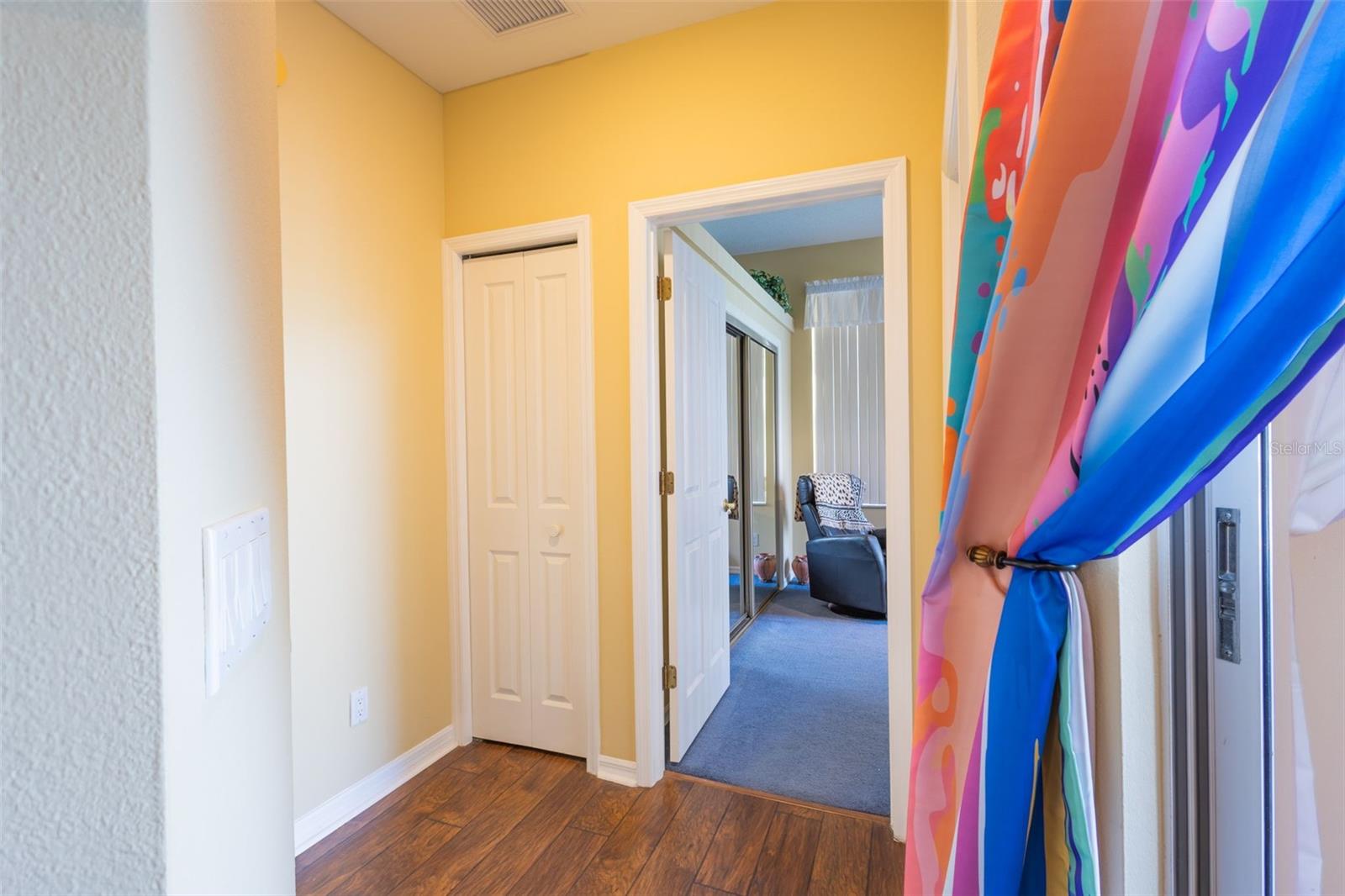 Coming in from the Family room, 3rd bedroom with the blue carpet.