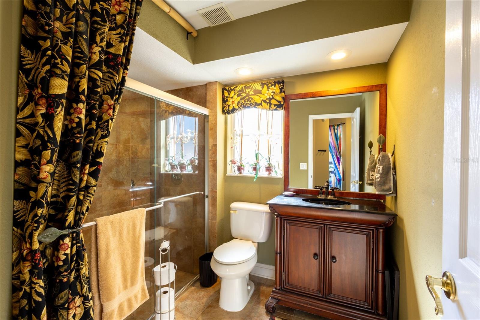 3rd bathroom next to the 2 guest bedrooms at the back of the home,