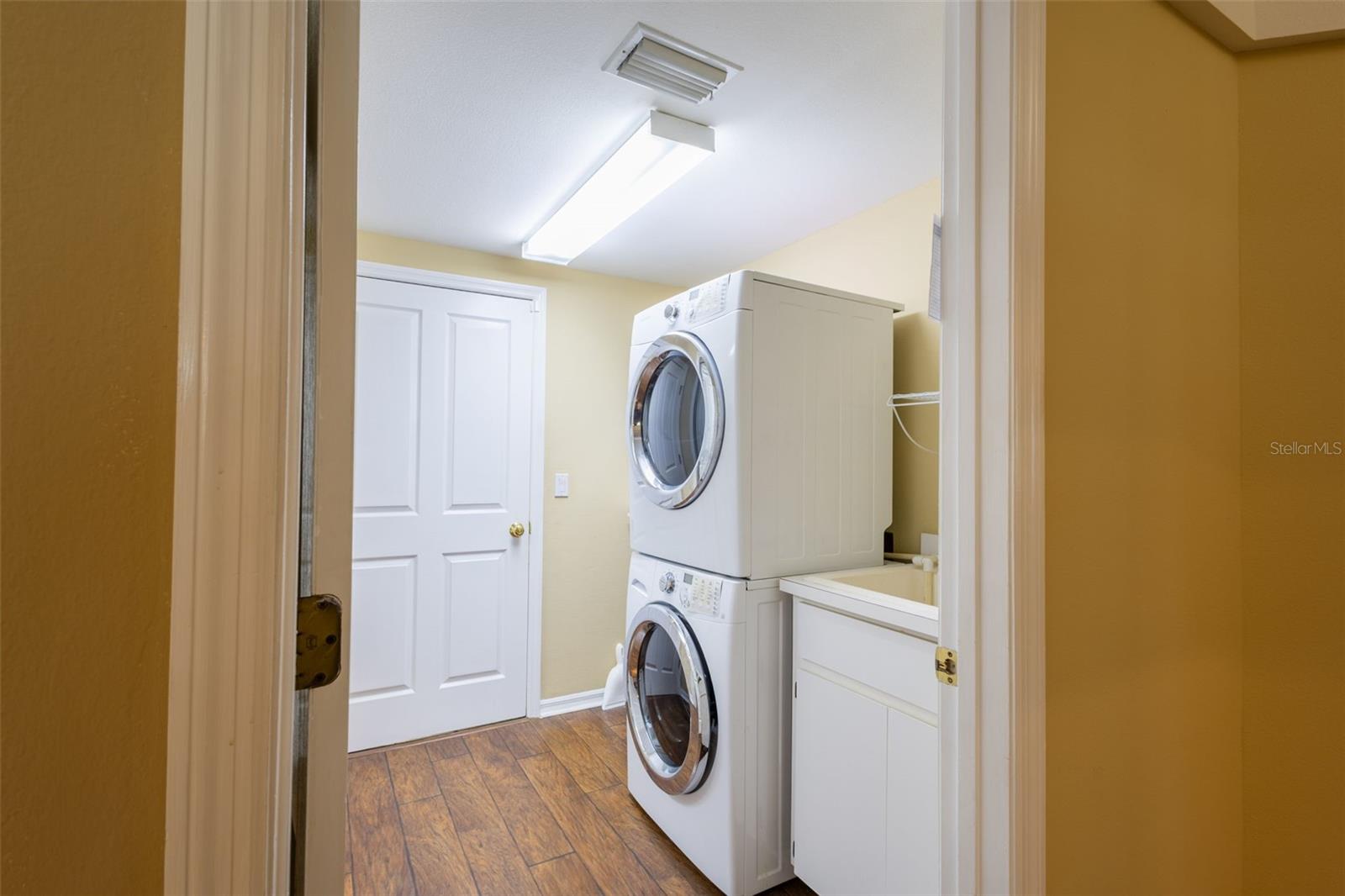 Laundry off the kitchen, good sized closet across from the washer and dryer, and through the door leads to the 3 car garage.