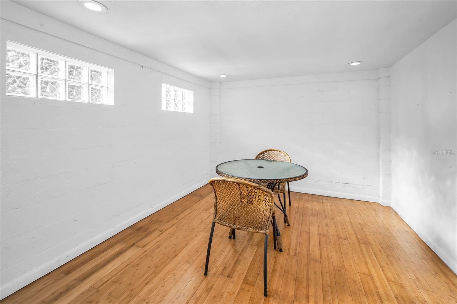 Lower level area perfect for the home office, gym or In-law suite!  Adjacent to the Garage
