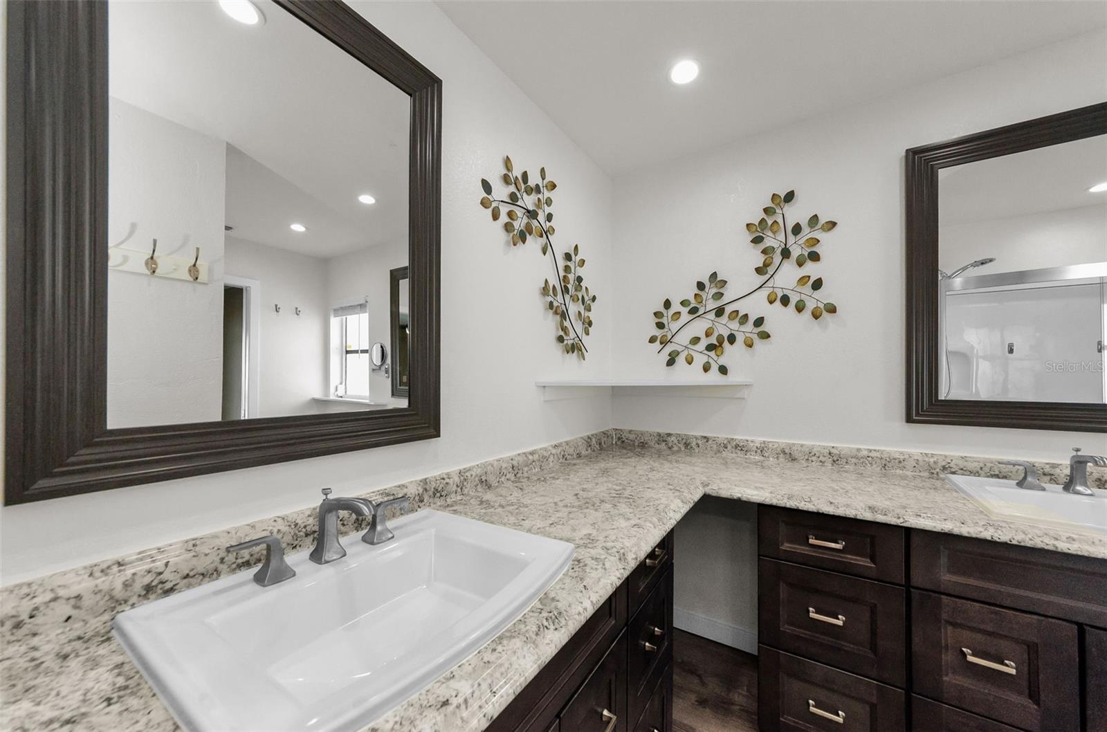 Bathroom between bedrooms with double sinks
