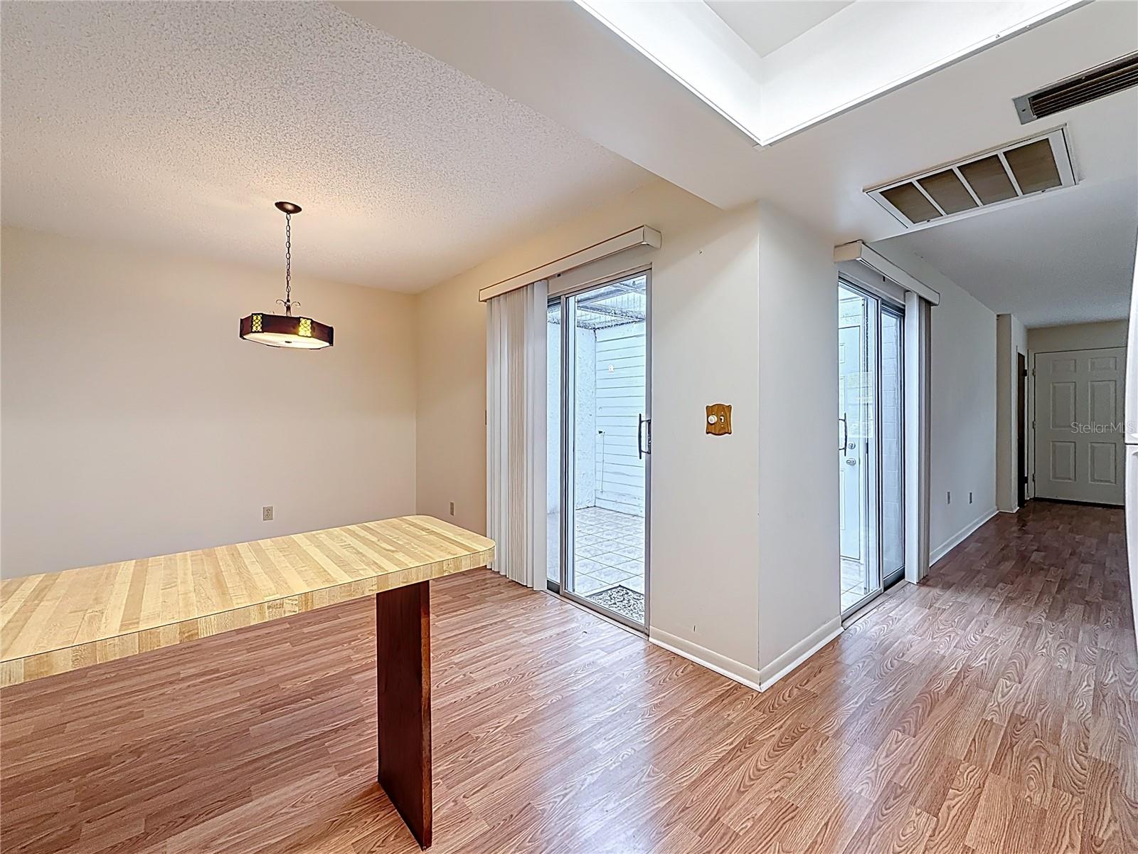 Atrium Access from Dining and Living Areas