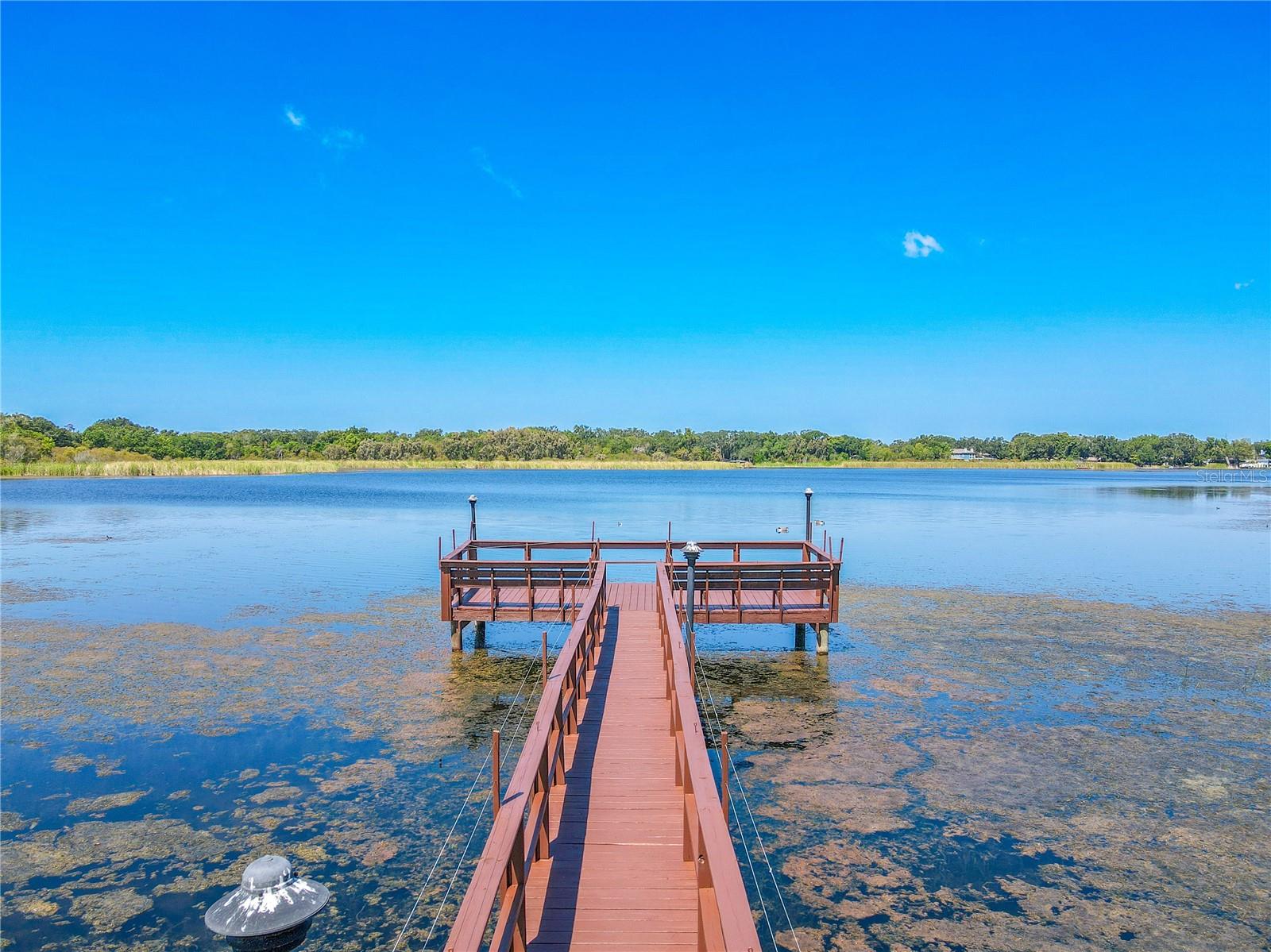 Lakefront living at its best with a pier perfect for fishing or simply enjoying the view.