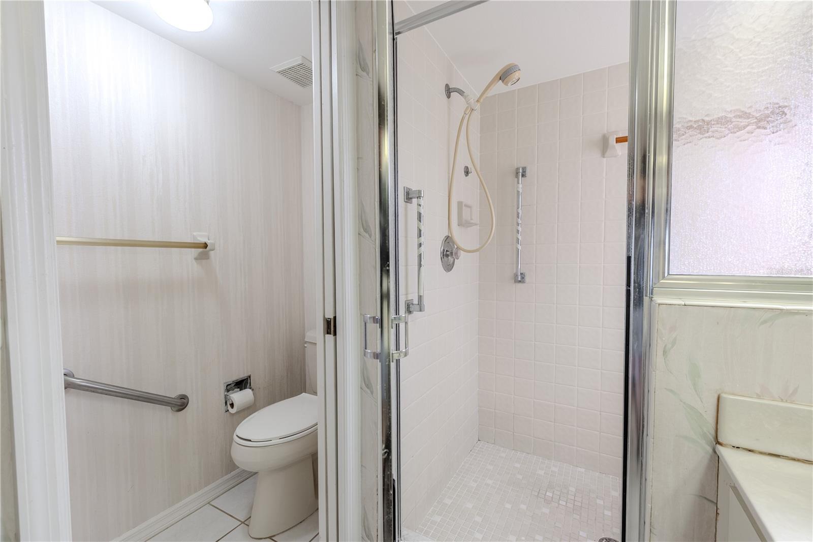 Primary bath includes a step-in shower and private water closet.