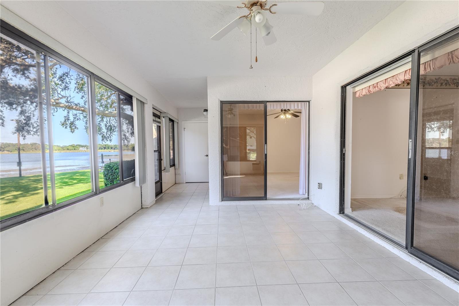 Bright and versatile enclosed lanai, cooled with its own AC for year-round enjoyment.
