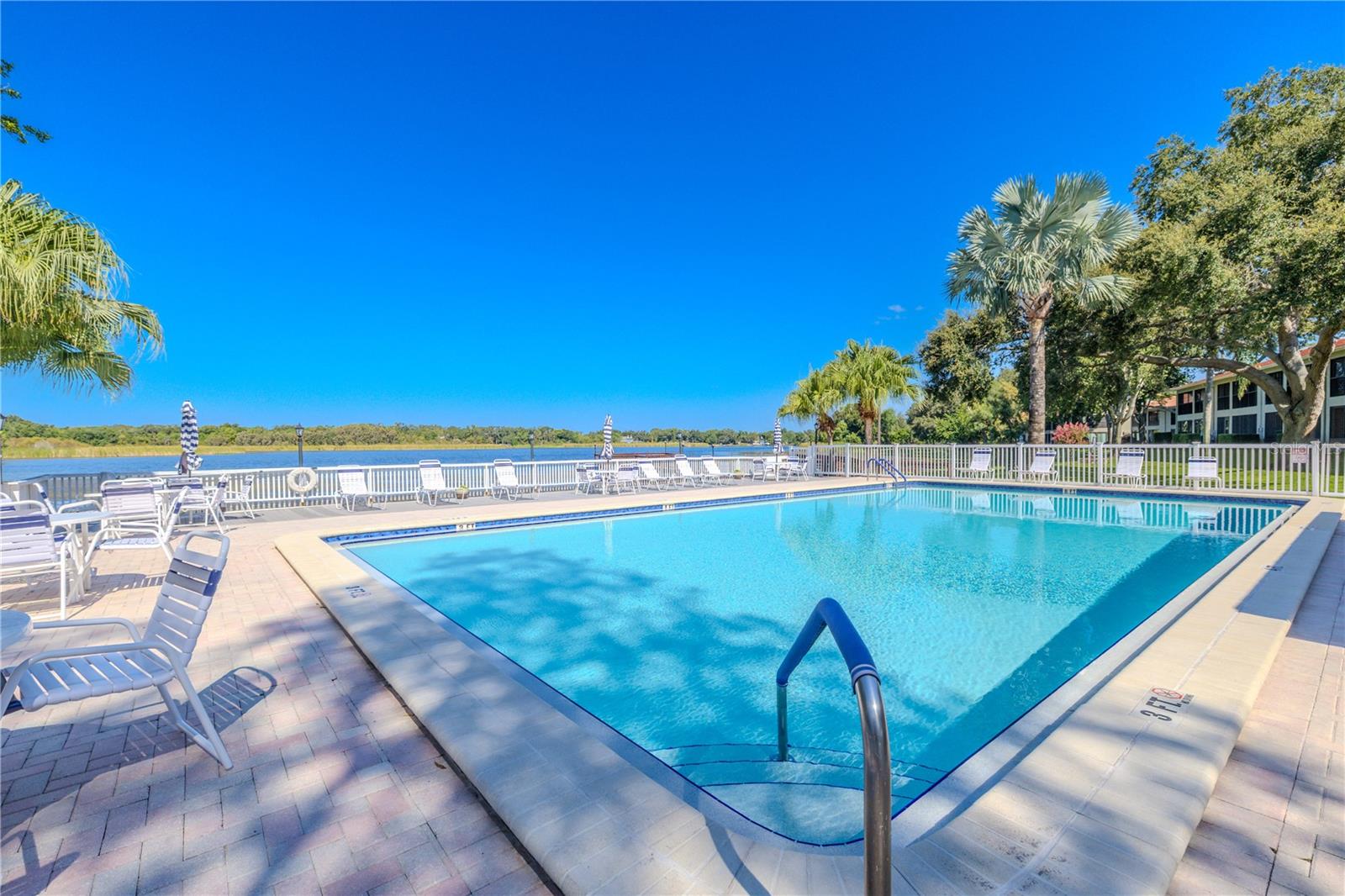 Swim a few laps or simply lounge by the sparkling pool, all set against a stunning lakefront backdrop.