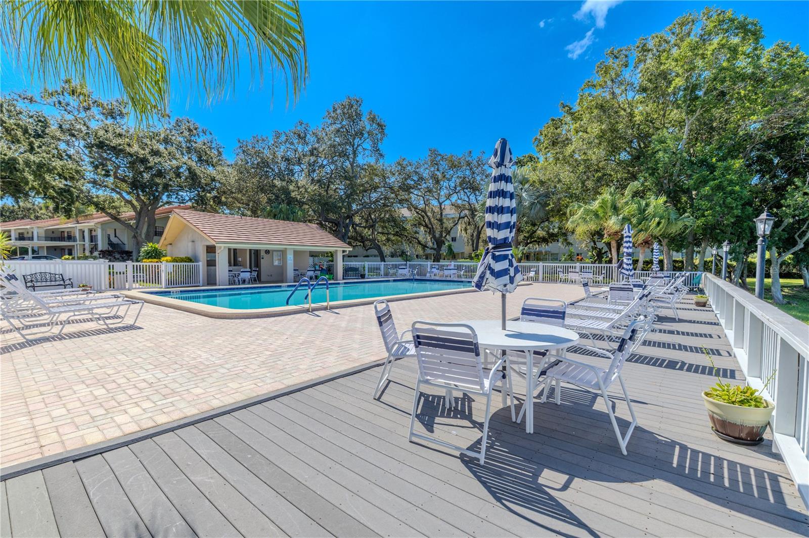 The pool deck offers plenty of space to stretch out and enjoy the Florida sunshine with friends and neighbors.