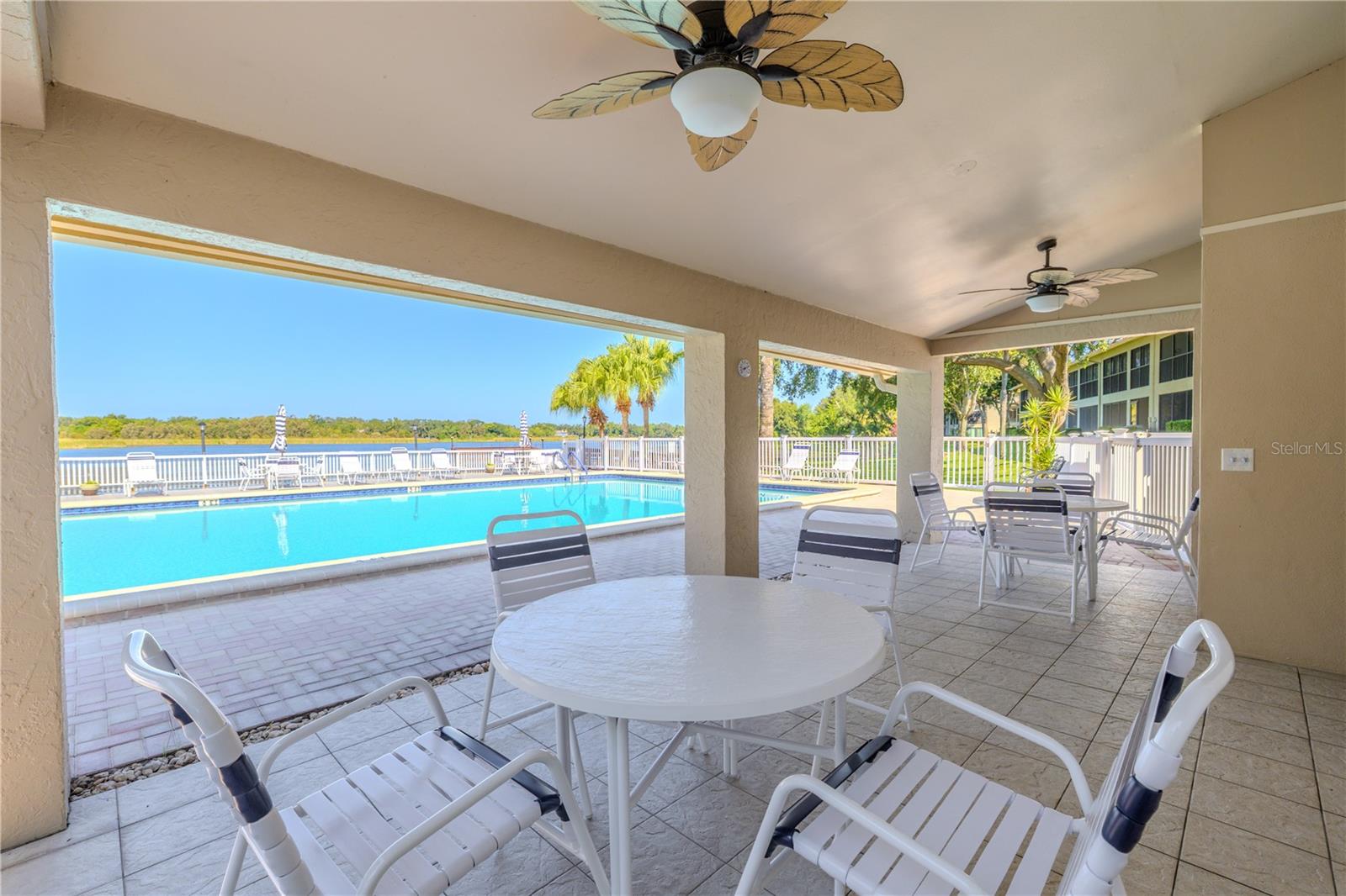 Covered seating by the pool provides a shady retreat where you can cool off and take in the view.