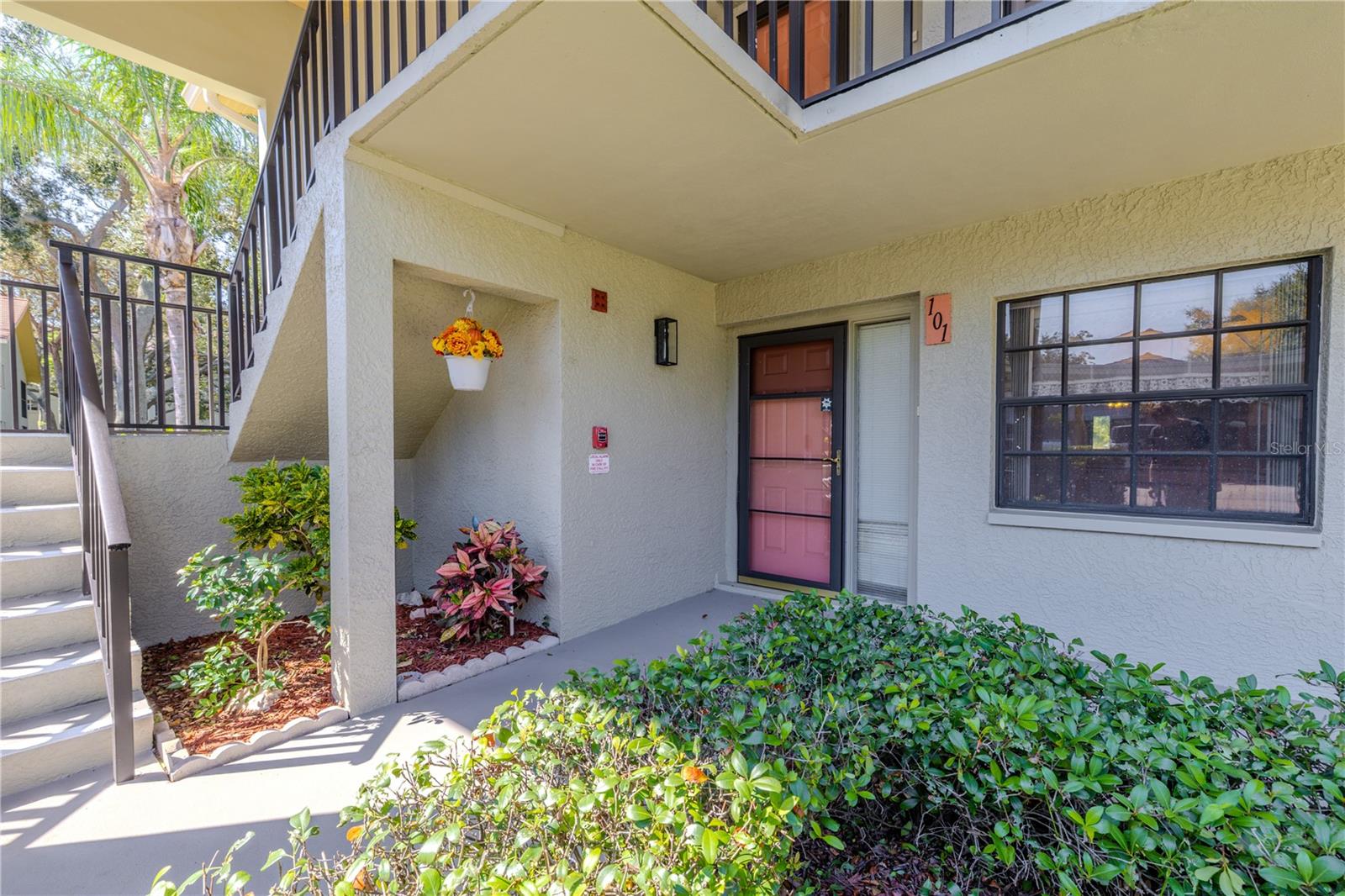 Corner unit privacy begins at your covered entryway, offering both shade and a welcoming first impression.