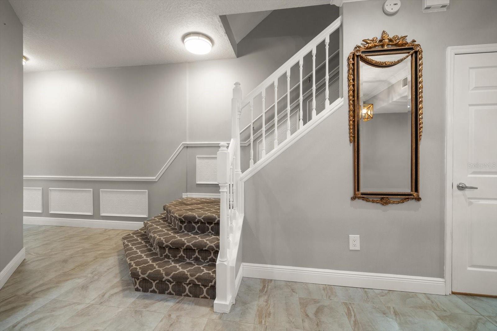 Stairway landing on main level; view from dining room