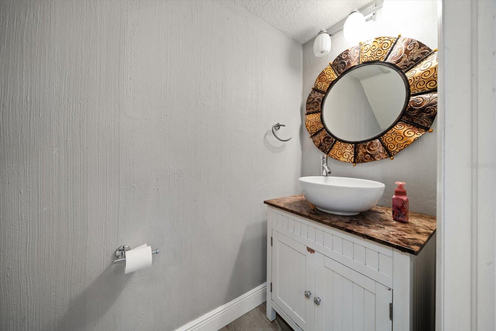 Main level half bath under staircase