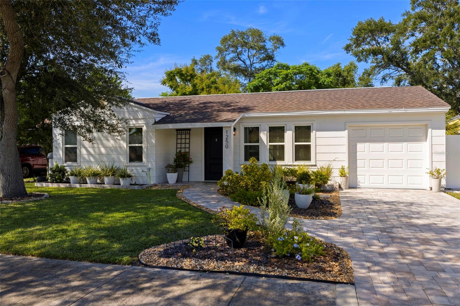 Charming home with great curb appeal that welcomes you from sidewalk to new pavers