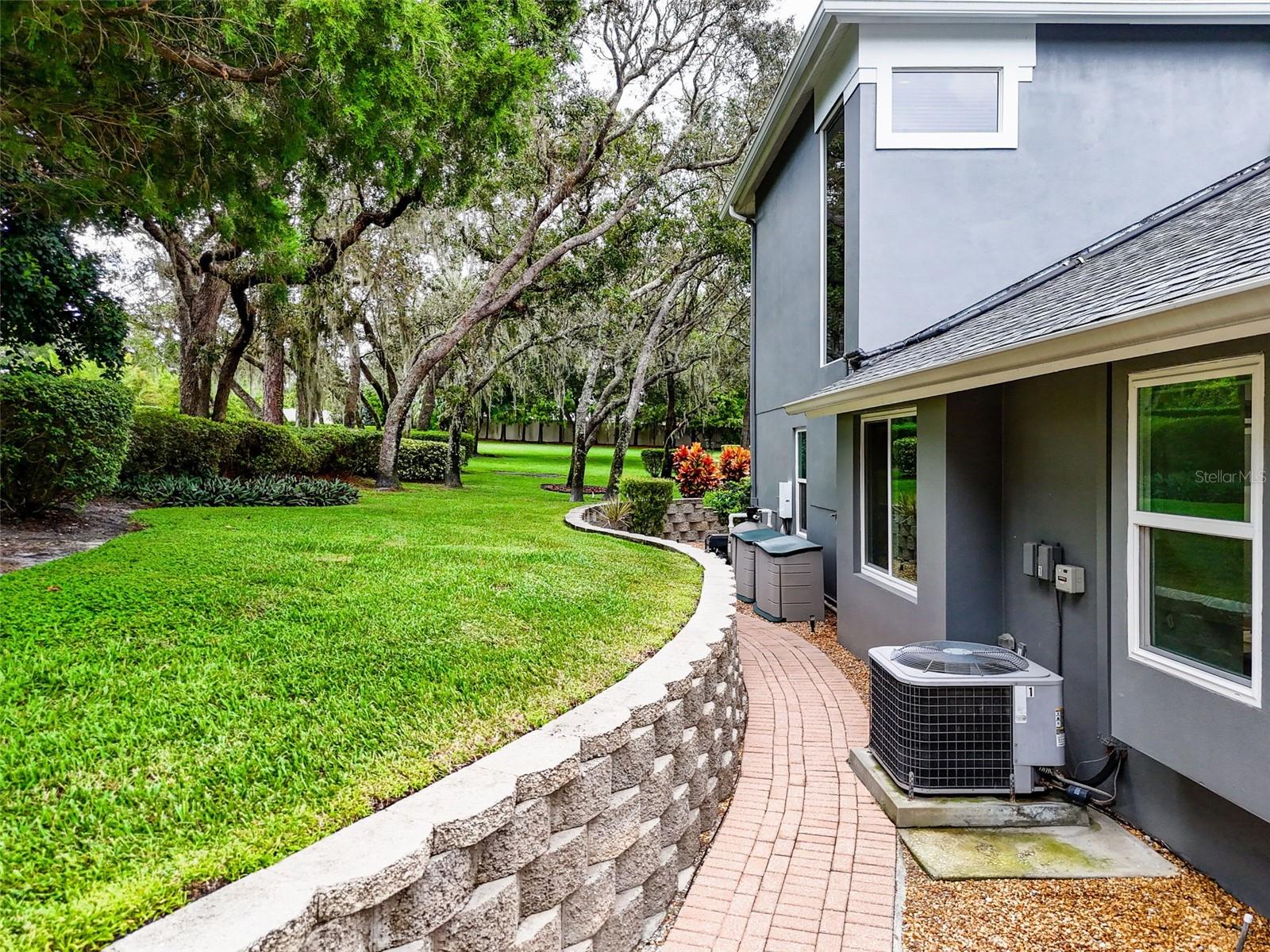 walkway from garage around home to pool & fireplace