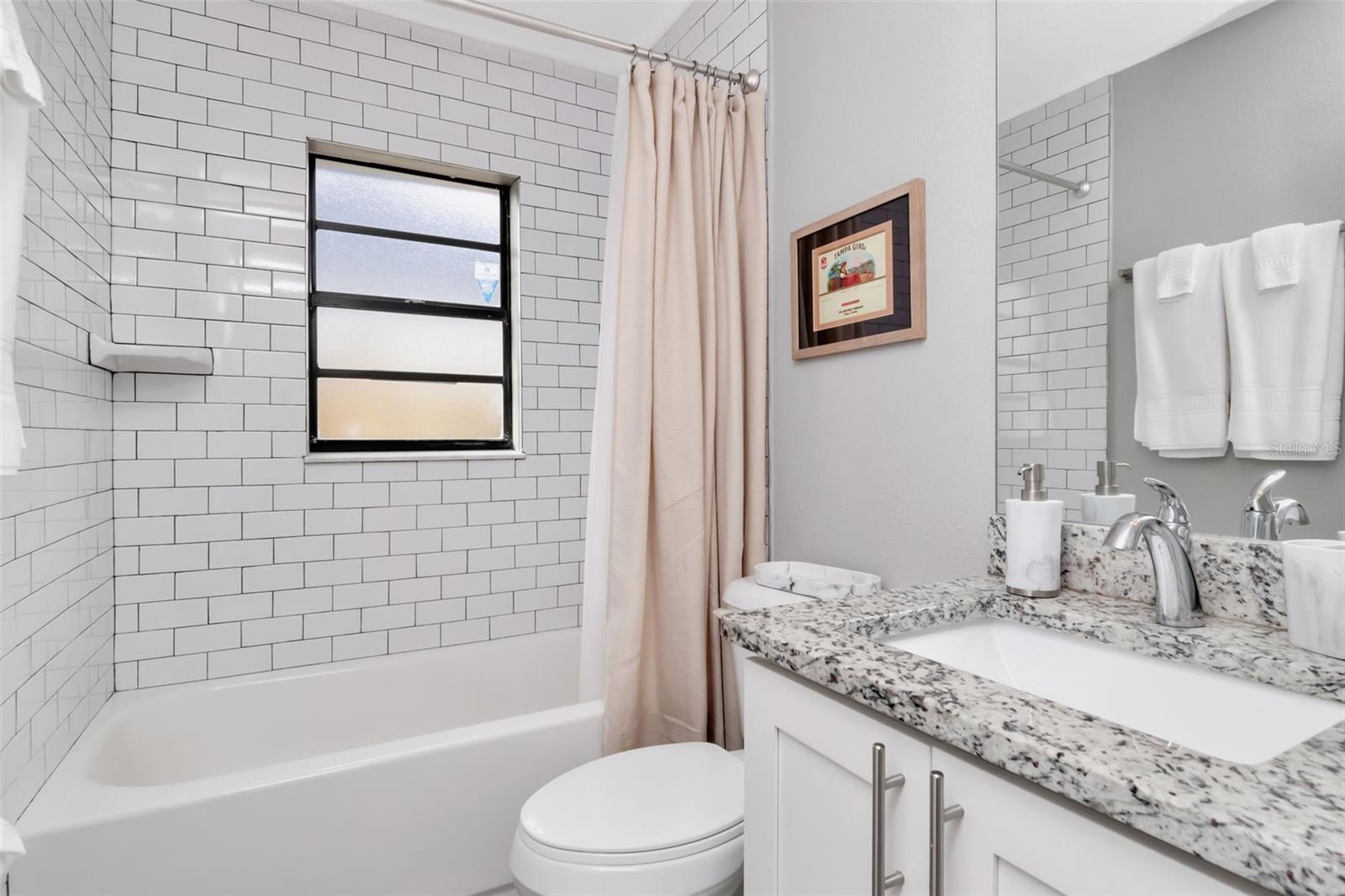 2nd full bath that services bedrooms 2 & 3 as well as guests.