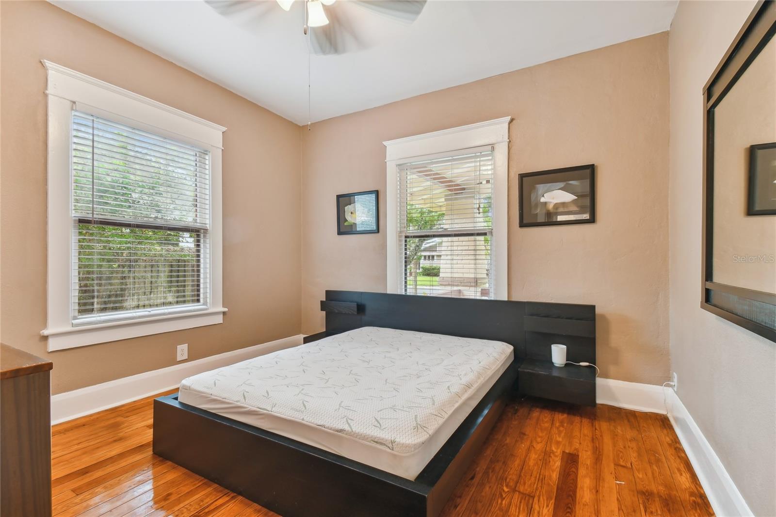 Spacious guest room with lots of natural light.