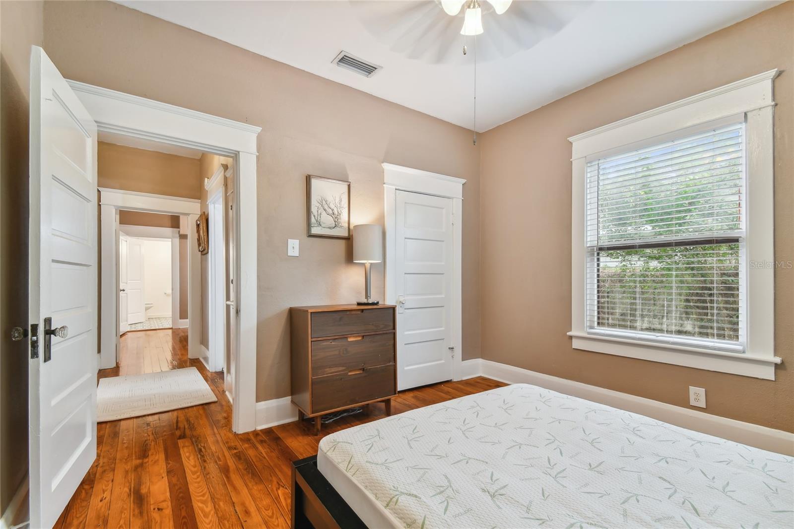 Guest room has a perfect wall for additional dresser