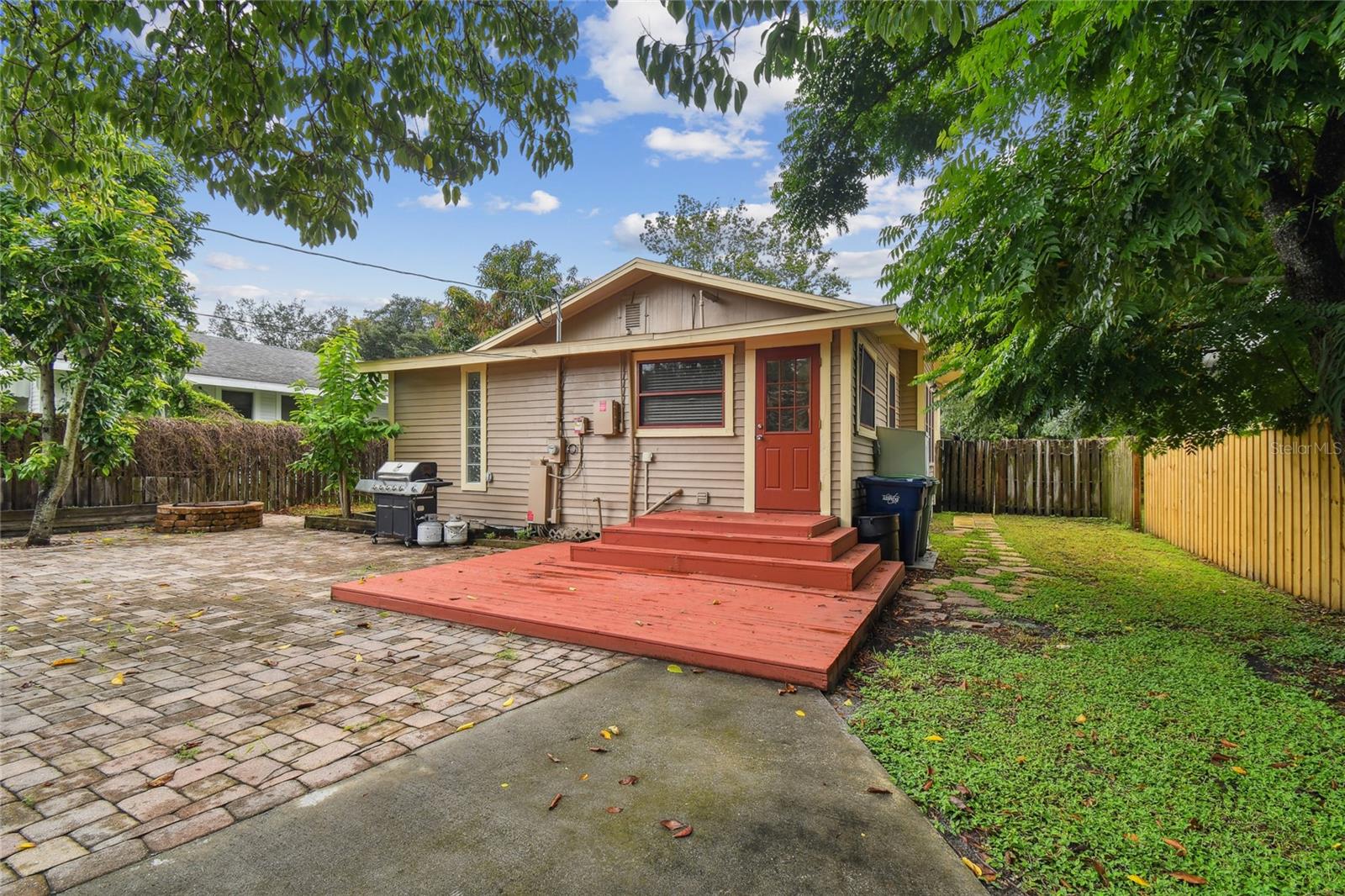 Rear of home opens to a great deck and paved entertainment area.