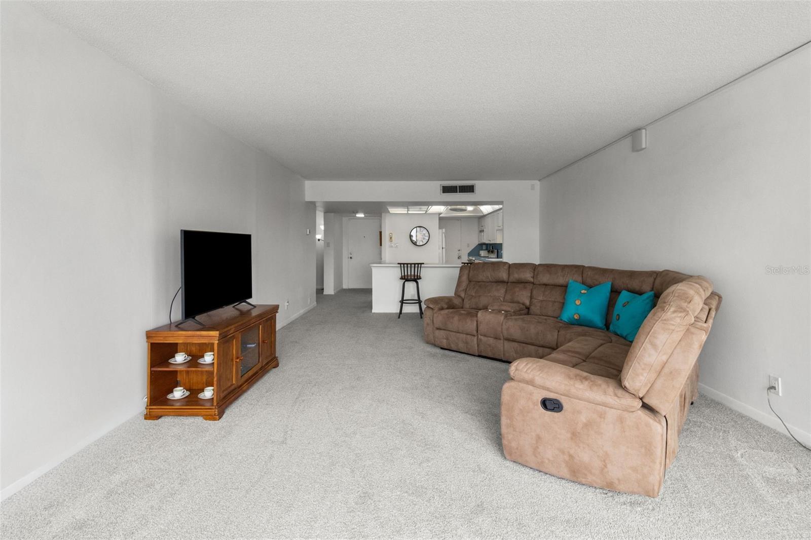 THE LIVING ROOM OFFERS PLENTY OF SPACE TO EITHER DIVIDE THE SPACE OR ADD MORE FURNISHINGS.