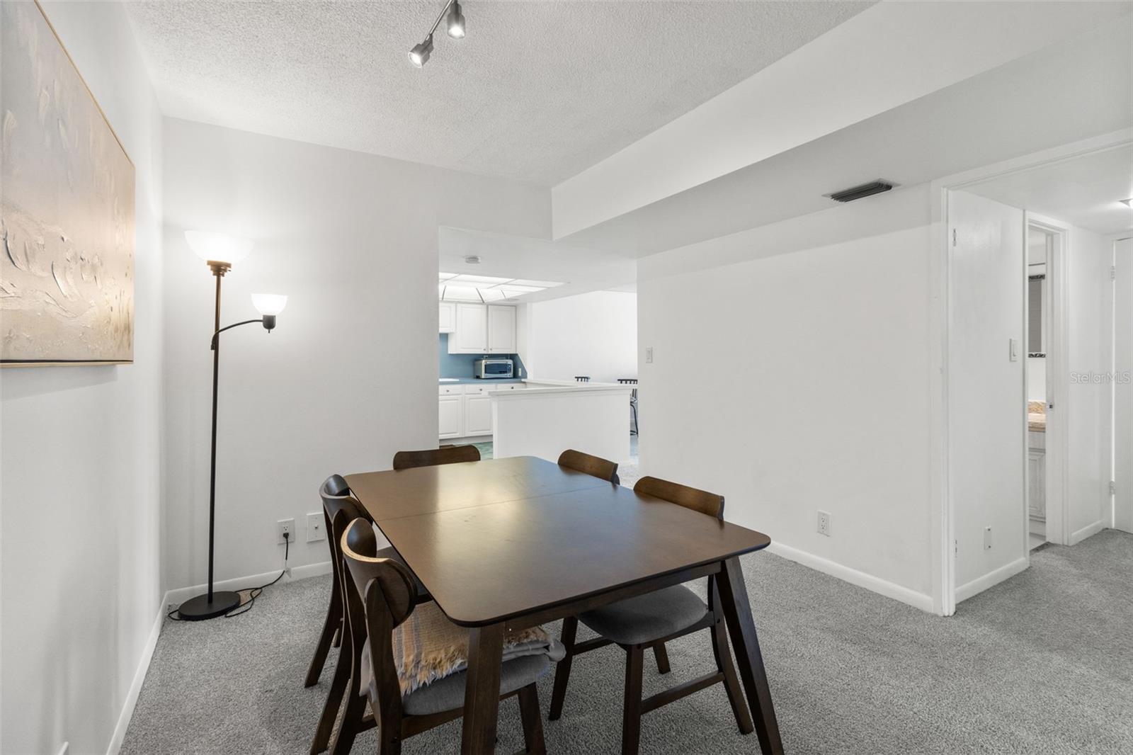 THE DINING ROOM PROVIDES AMPLE WALL SPACE, PERFECT FOR SHOWCASING YOUR PERSONAL STYLE.