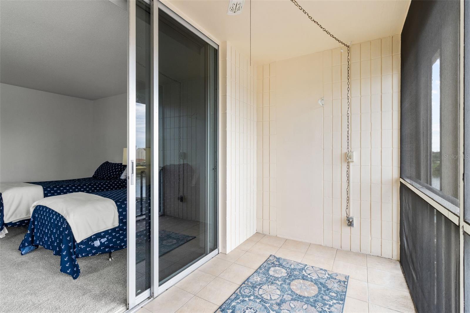 STEP RIGHT OUT ONTO YOUR PRIVATE, TILED, SCREENED, WATER VIEW, BALCONY! ENJOY THE VIEWS, THE BREEZES AND THE TROPICAL FLAIR!