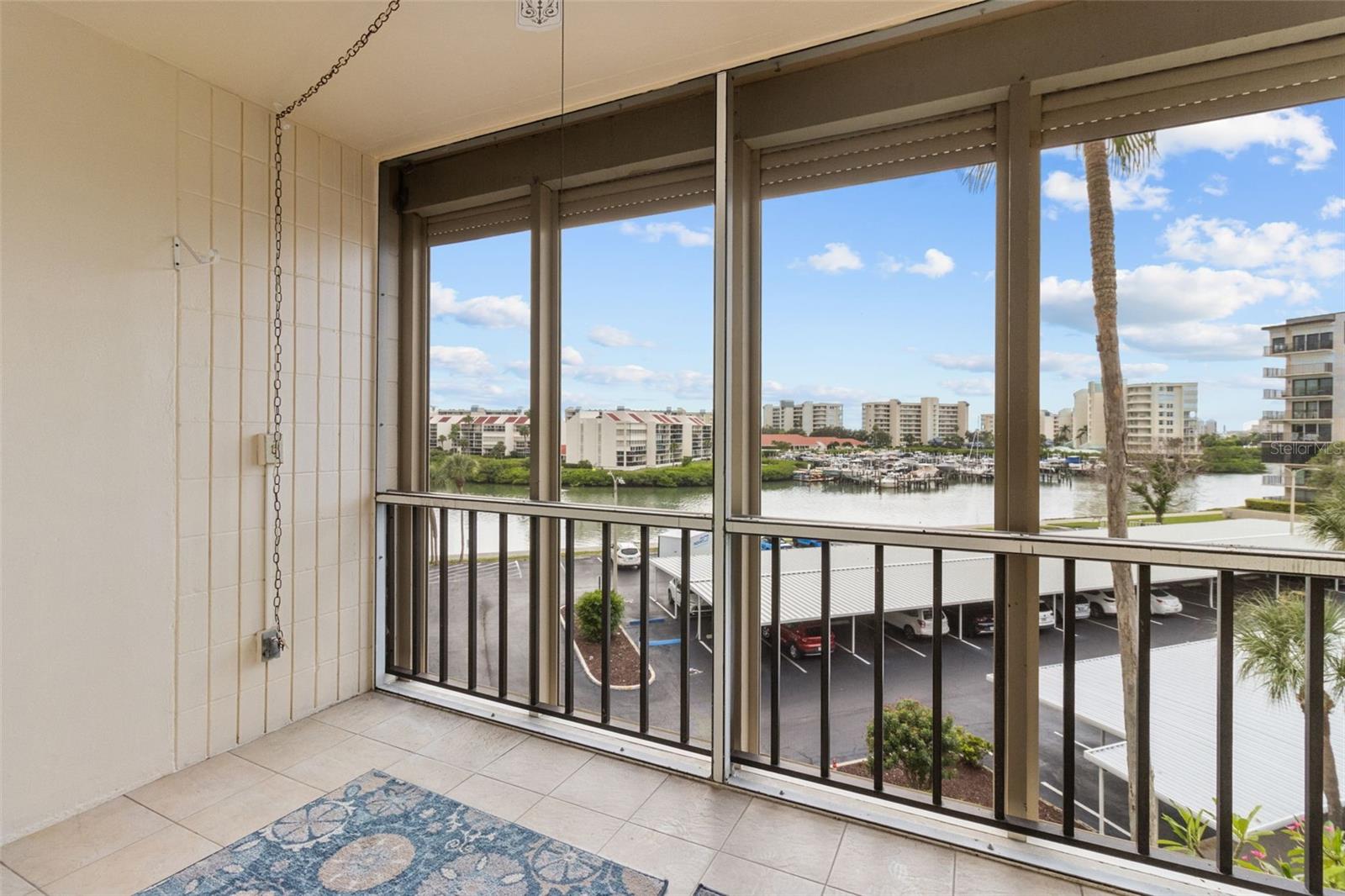 THE BALCON IS SCREENED FOR FULL ENJOYMENT.  THE HURRICANE SHUTTERS ARE BOTH ELECTRIC AND MANUEL.