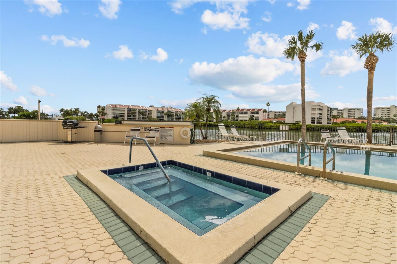 IMAGINE RELAXING IN THE HEATED SPA WHILE ENJOYING TROPICAL BREEZES AND WATERVIEWS!