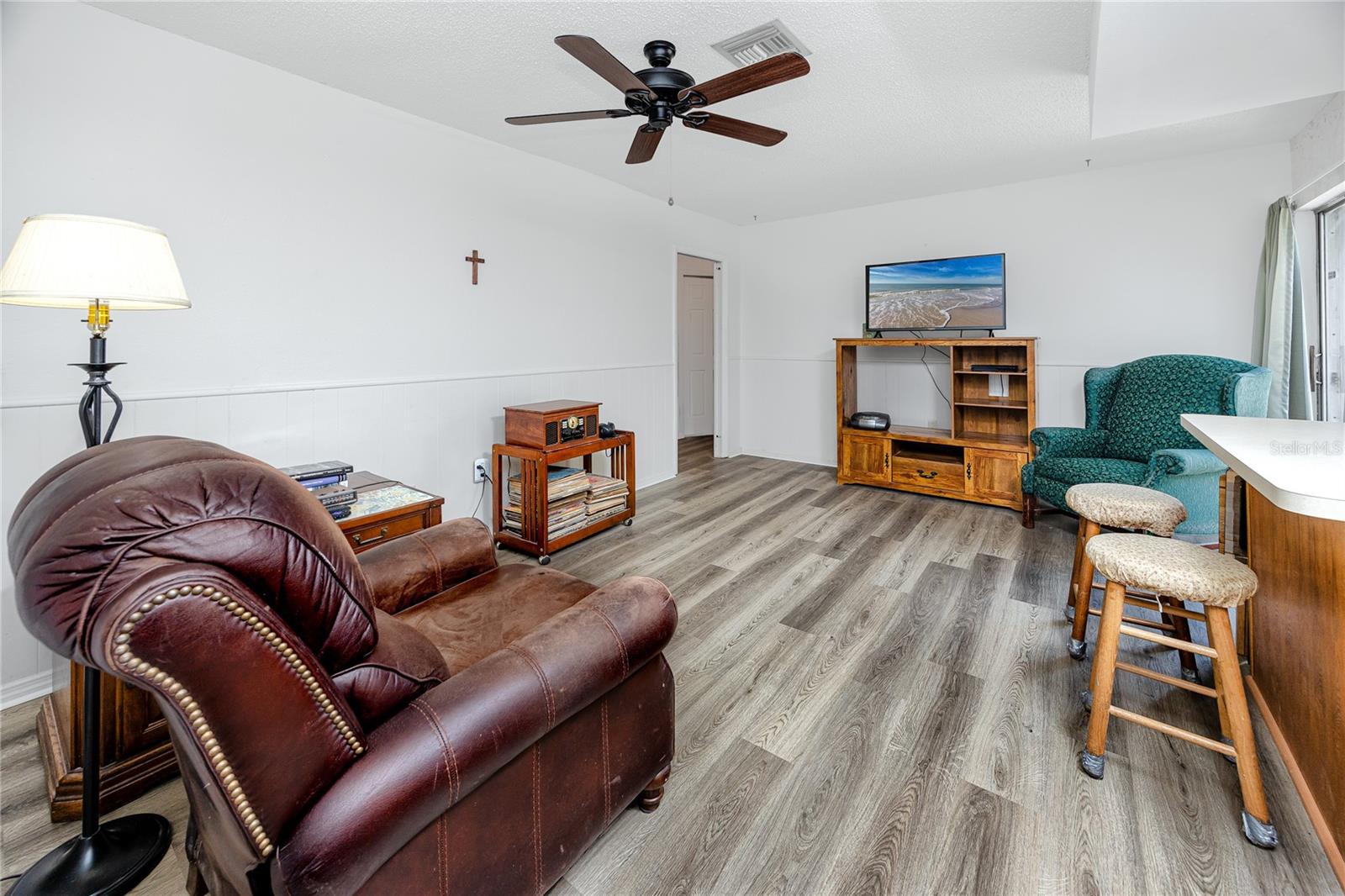 Family Room/Den off the kitchen. Door way on left leads to the three bedrooms and guest bathroom