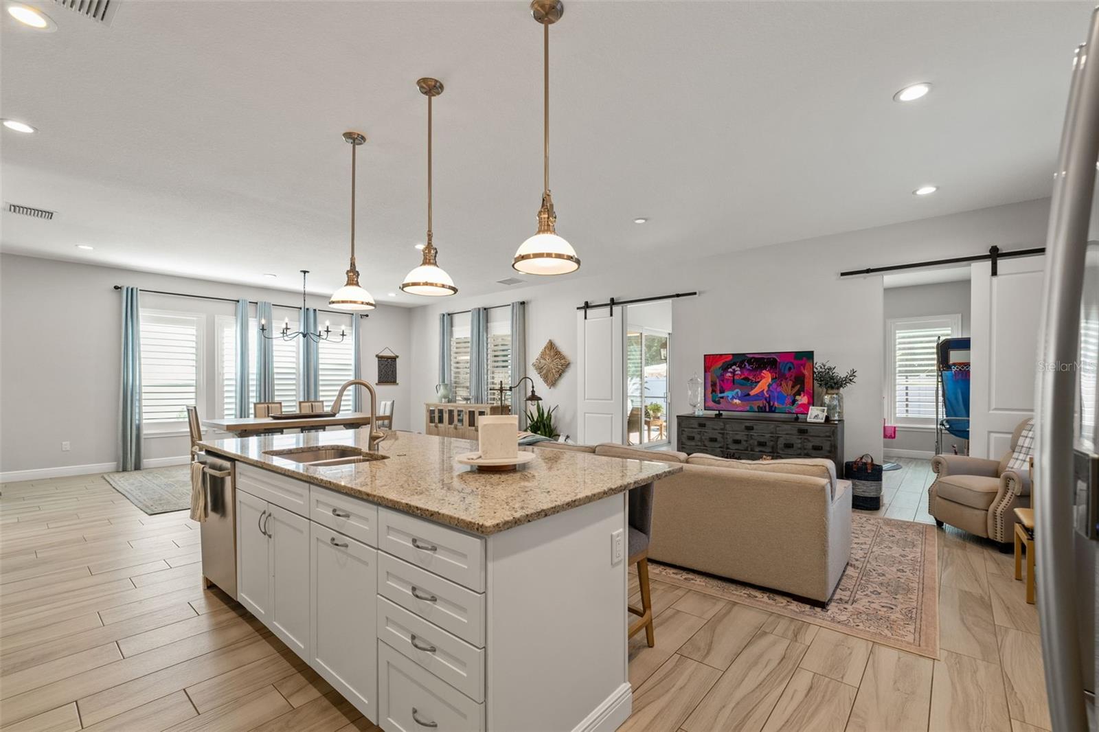 Open sightlines connect the kitchen to the living space, enhancing the home’s bright and welcoming feel.