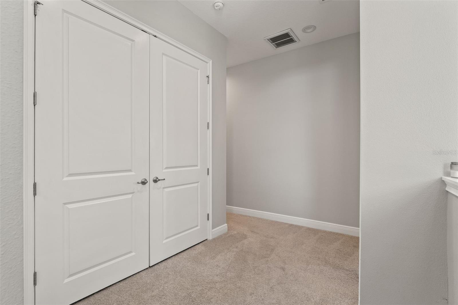 Spacious landing area with double-door storage, offering convenience and functionality.