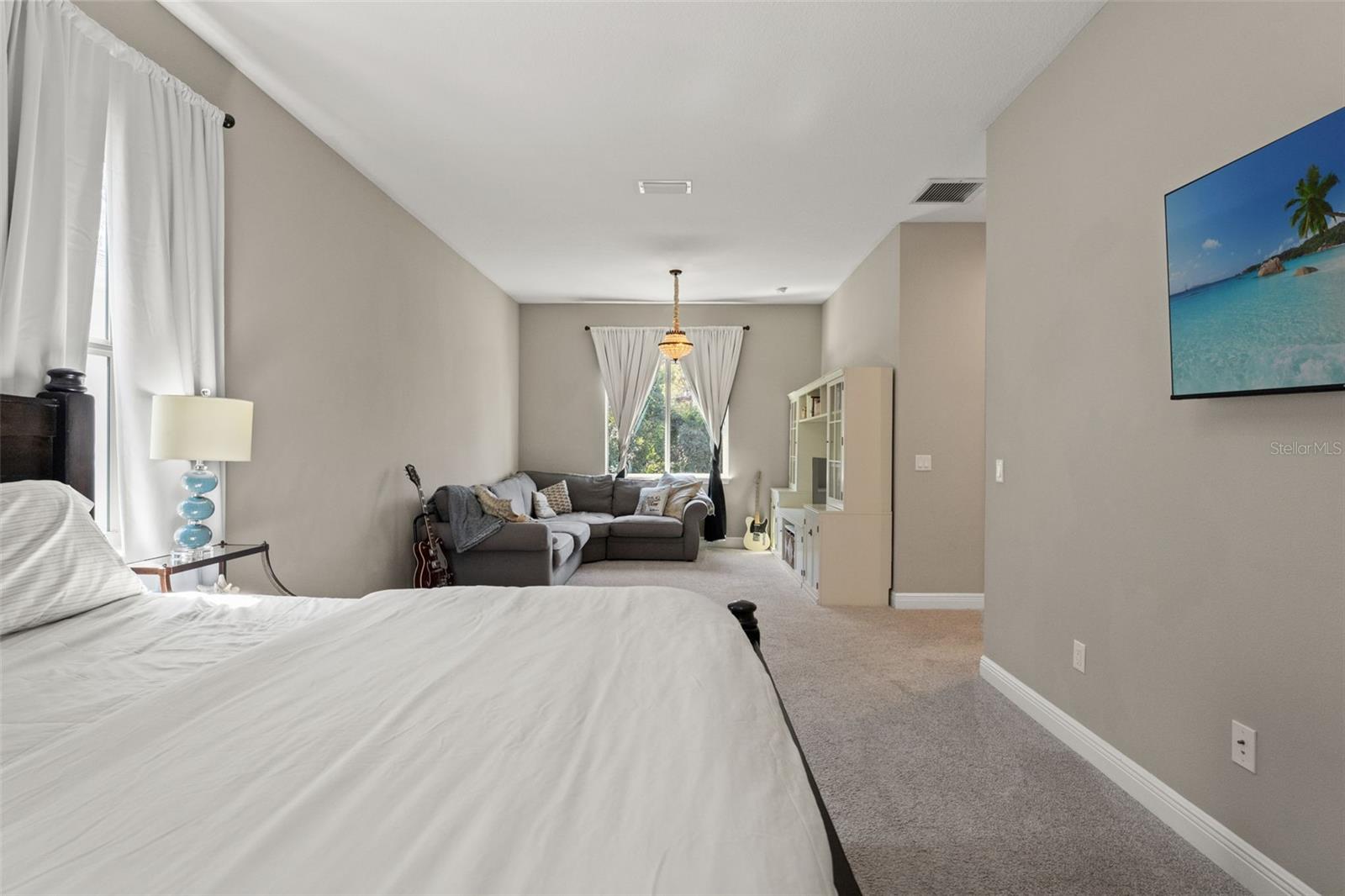 Cozy retreat within the suite, perfect for lounging or reading, with views of the backyard.