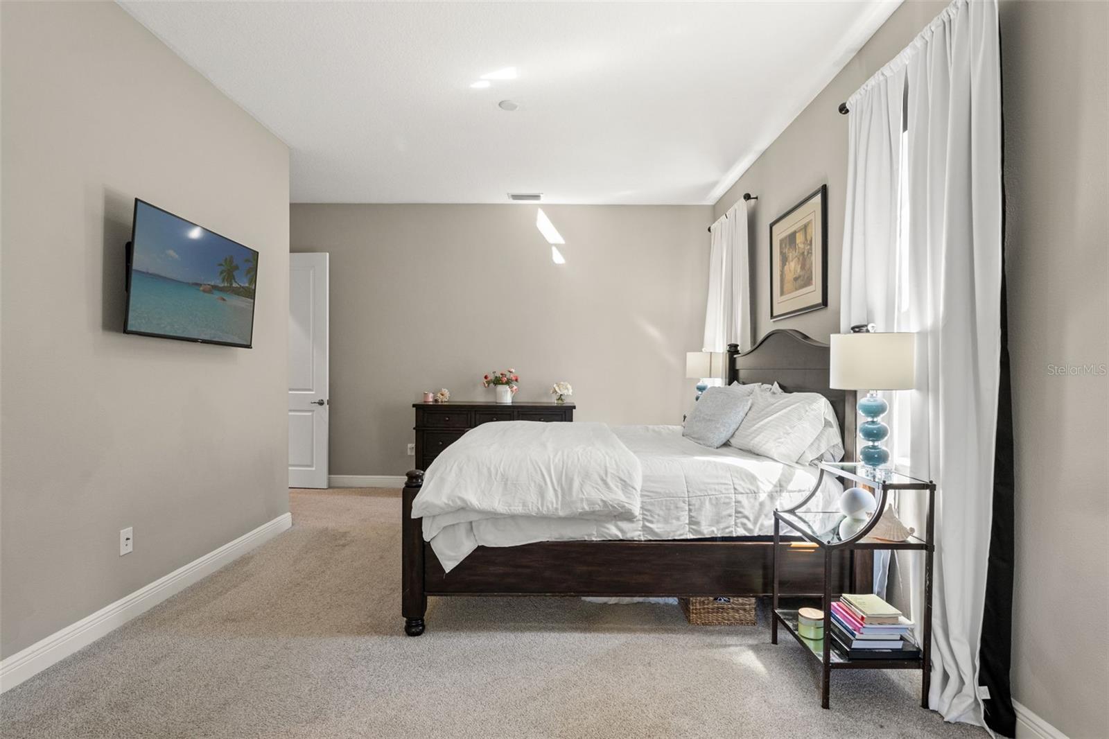 Bright and spacious design with neutral tones, offering versatility in layout and furniture placement.