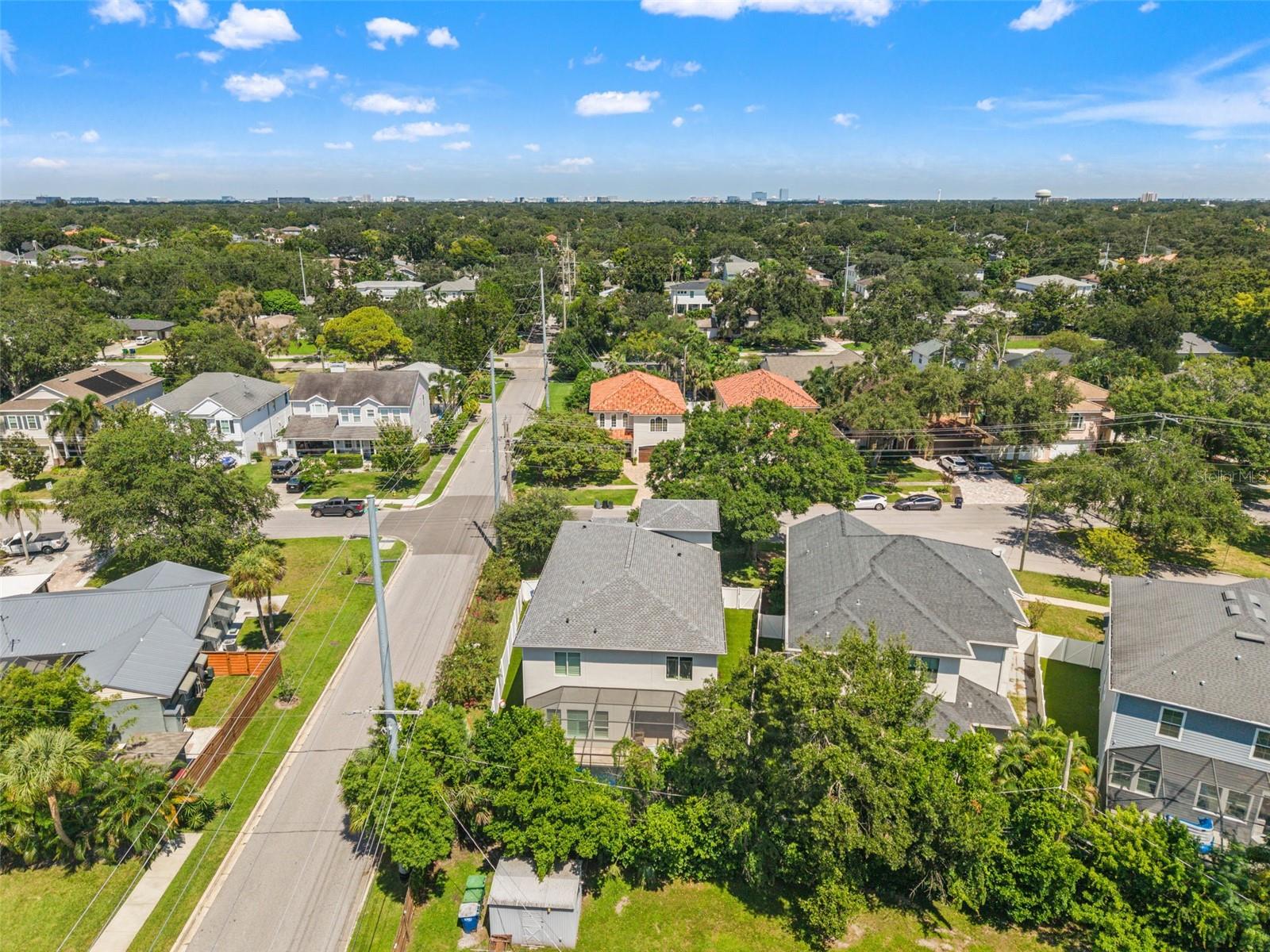 Overhead look showcasing the residence, driveway, and surrounding homes.