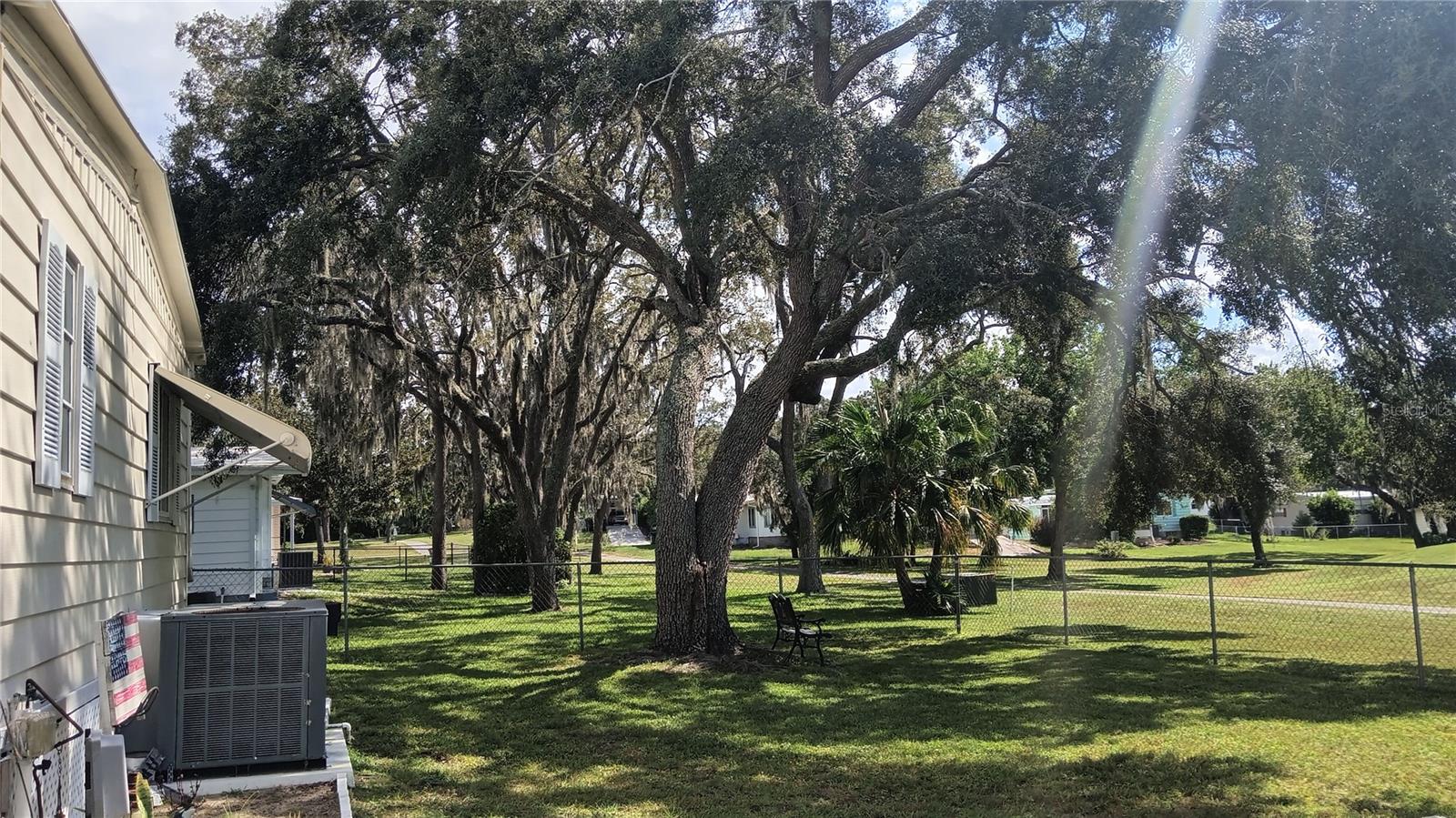 Peaceful, shady backyard overlooking the golf course