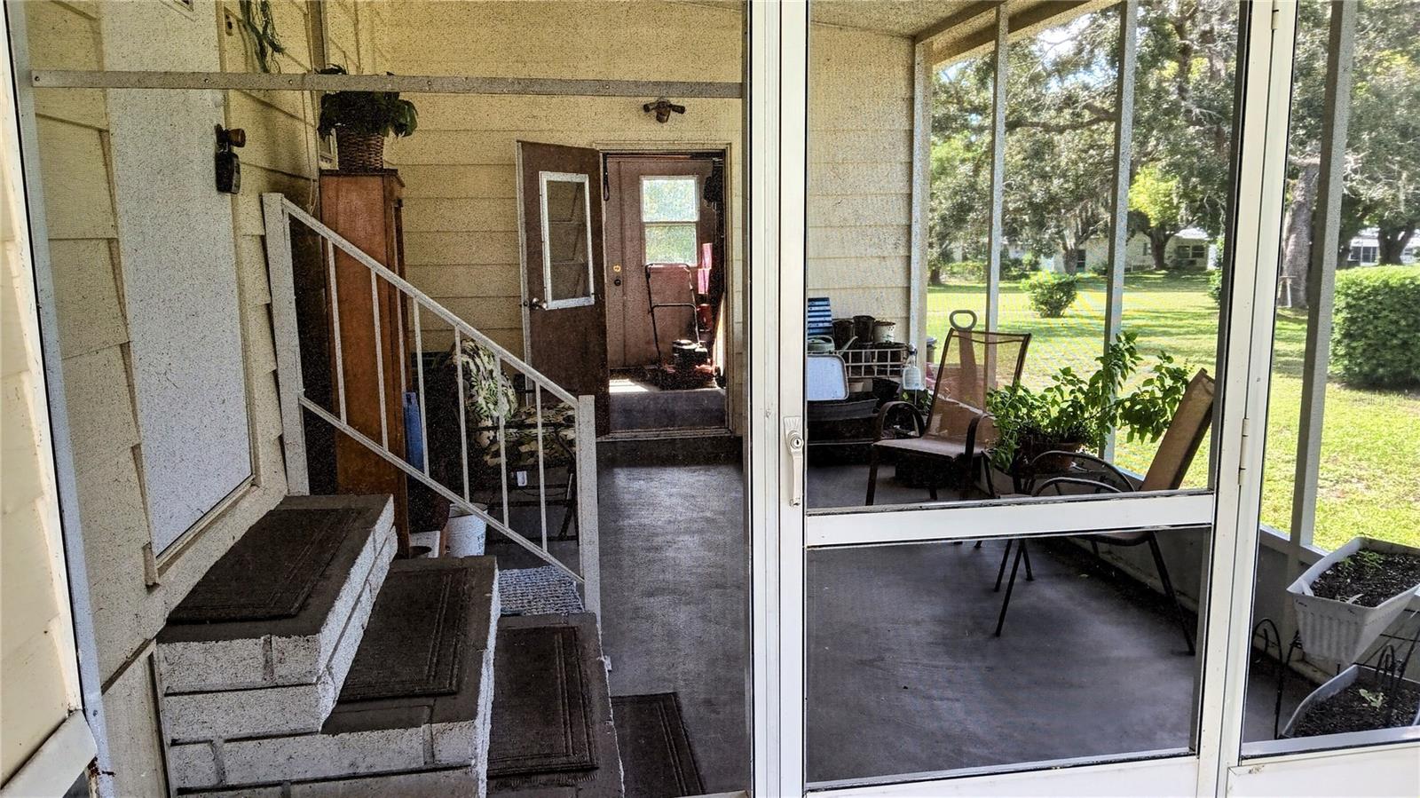 Screen room entrance from carport.