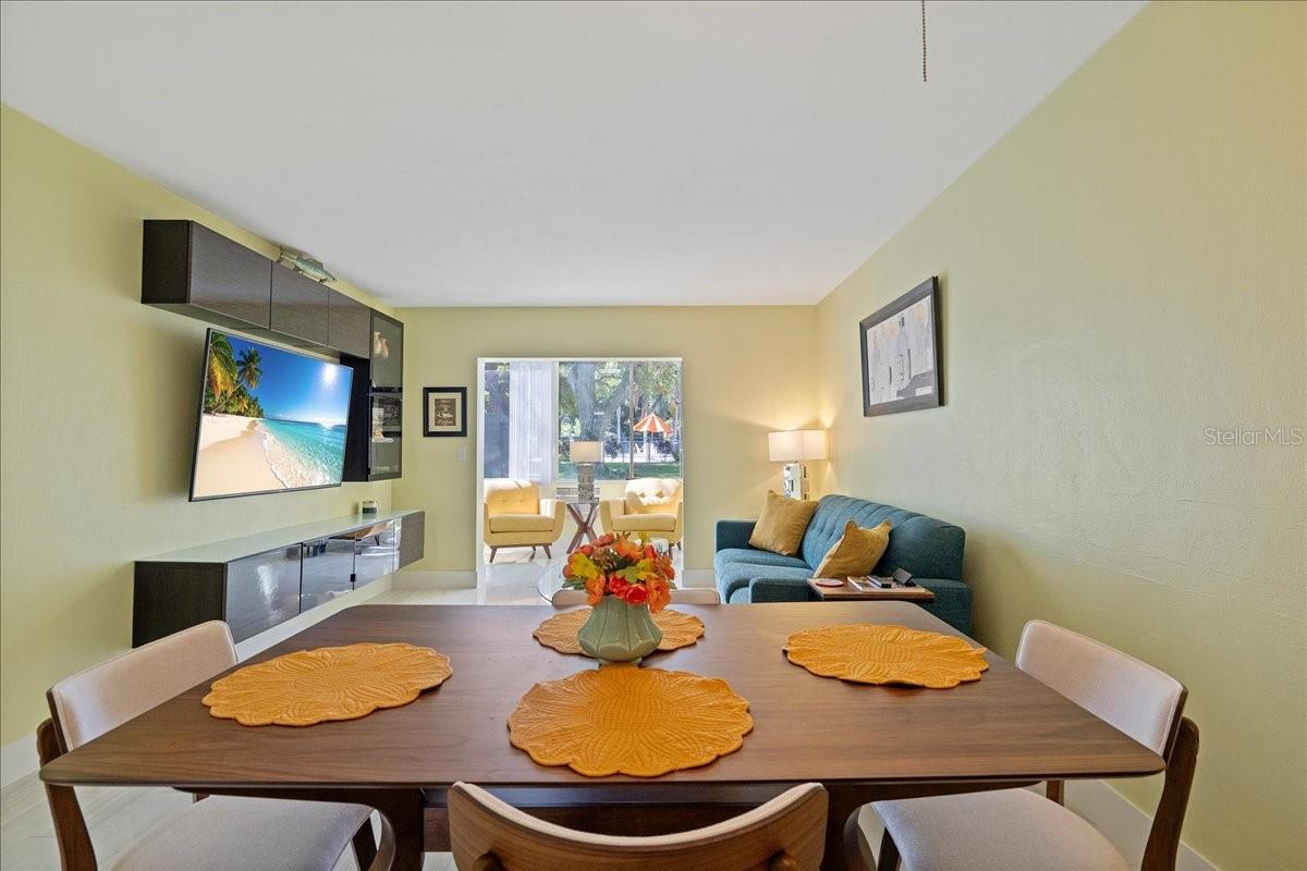 Dining area off kitchen flows into the living room