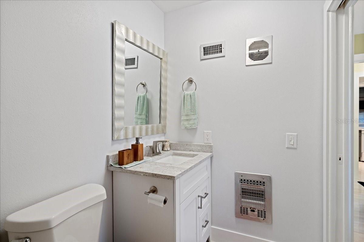 Updated ensuite bathroom with a beautifully tiled shower and a stylish vanity with a granite countertop